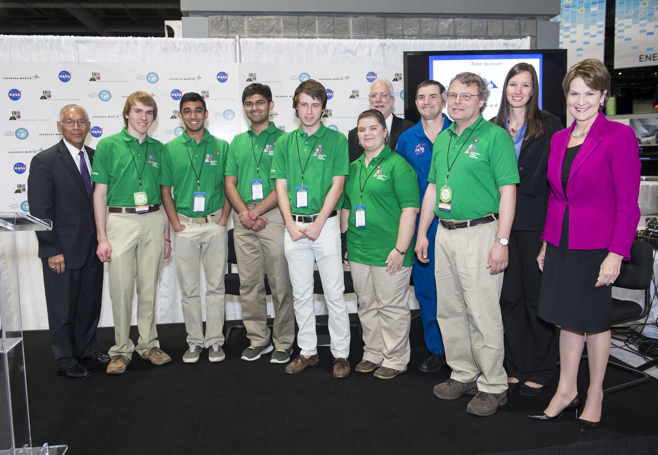NASA’s Administrator, Charles Bolden (left), President/CEO of Lockheed Martin, Marillyn Hewson (right), and astronaut Rex Walheim (back row) pose for a group photo with the winning high school team in the Exploration Design Challenge. Team ARES from the Governors School for Science and Technology in Hampton, Va. won the challenge with their radiation shield design, which will be built and flown aboard the Orion/EFT-1. The award was announced at the USA Science and Engineering Festival on April 25, 2014 at the Washington Convention Center. Photo Credit: (NASA/Aubrey Gemignani)
