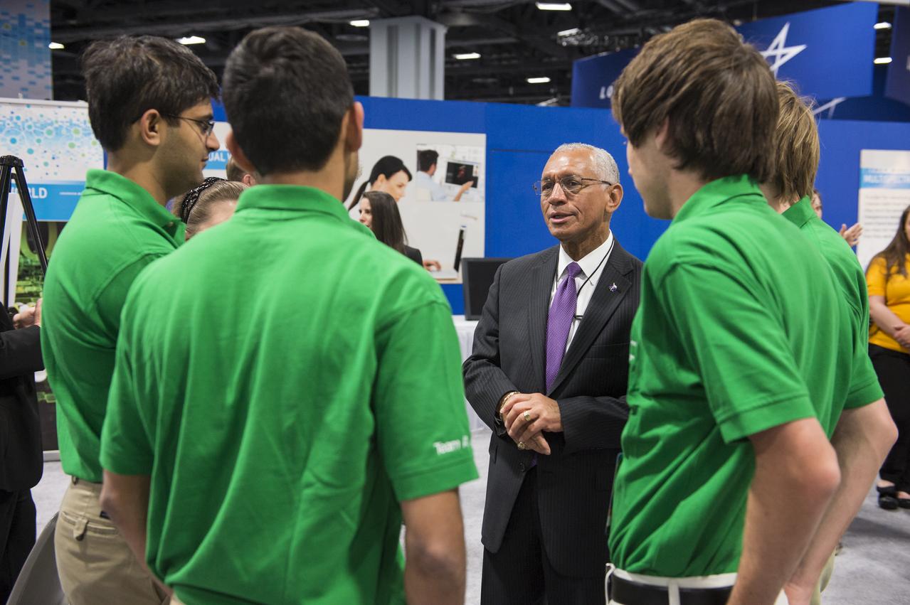 NASA’s Administrator, Charles Bolden speaks with the winning high school team in the Exploration Design Challenge prior to the award ceremony. Team ARES from the Governors School for Science and Technology in Hampton, Va. won the challenge with their radiation shield design, which will be built and flown aboard the Orion/EFT-1. The award was announced at the USA Science and Engineering Festival on April 25, 2014 at the Washington Convention Center. Photo Credit: (NASA/Aubrey Gemignani)