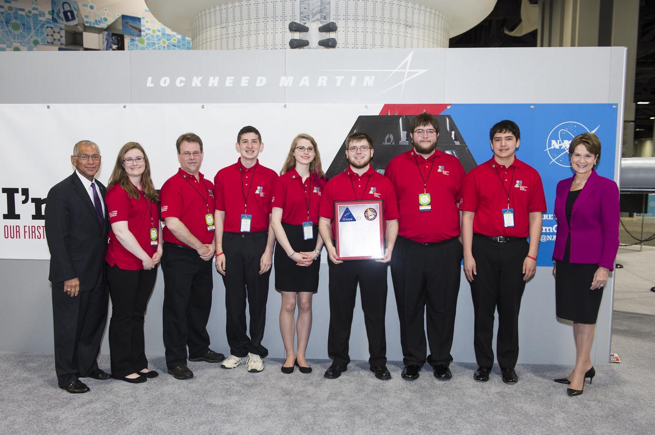 Team Titan Shielding Systems poses with NASA Administrator Charles Bolden and Lockheed Martin CEO, Marillyn Hewson. Team Titan Shielding Systems was one of the semi-finalists in the Exploration Design Challenge. The goal of the Exploration Design Challenge is for students to research and design ways to protect astronauts from space radiation. The winner of the challenge was announced on April 25, 2014 at the USA Science and Engineering Festival at the Washington Convention Center in Washington, DC. Photo Credit: (NASA/Aubrey Gemignani)