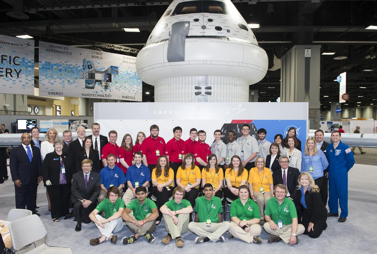 Sponsors of all of the semi-finalist teams in the Exploration Design Challenge pose for a group photo with the teams. Team ARES from the Governors School for Science and Technology in Hampton, Va. won the challenge with their radiation shield design, which will be built and flown aboard the Orion/EFT-1. The award was announced at the USA Science and Engineering Festival on April 25, 2014 at the Washington Convention Center. Photo Credit: (NASA/Aubrey Gemignani)