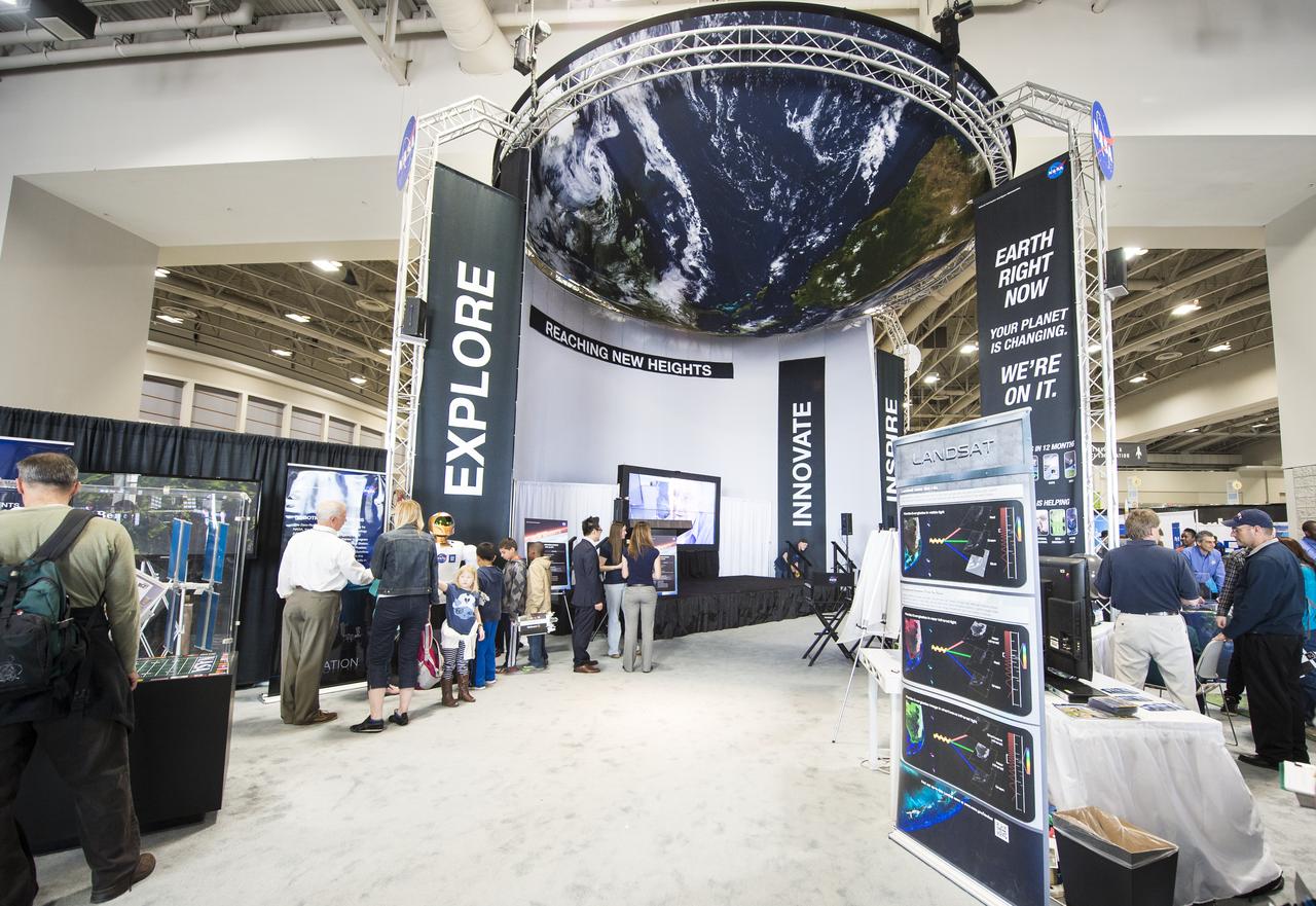 Attendees of the USA Science and Engineering Festival explore all of the exhibits at the NASA Stage. The USA Science and Engineering Festival took place at the Washington Convention Center in Washington, DC on April 26 and 27, 2014. Photo Credit: (NASA/Aubrey Gemignani)