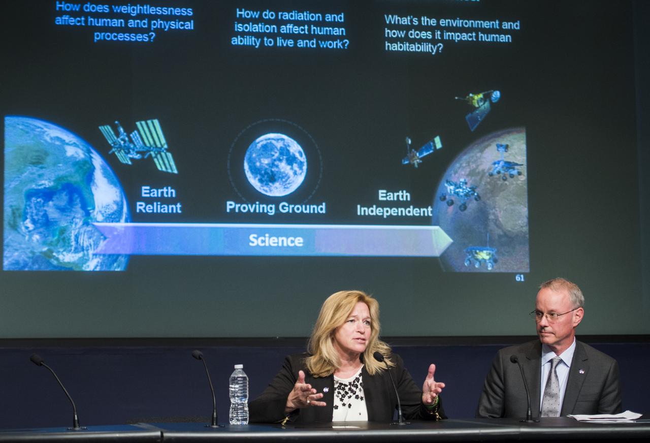 Ellen Stofan, NASA Chief Scientist, left, and David Miller, NASA Chief Technologist, right, participate in a panel discussion during an Exploration Forum showcasing NASA's human exploration path to Mars in the James E. Webb Auditorium at NASA Headquarters on Tuesday, April 29, 2014. Photo Credit: (NASA/Joel Kowsky)