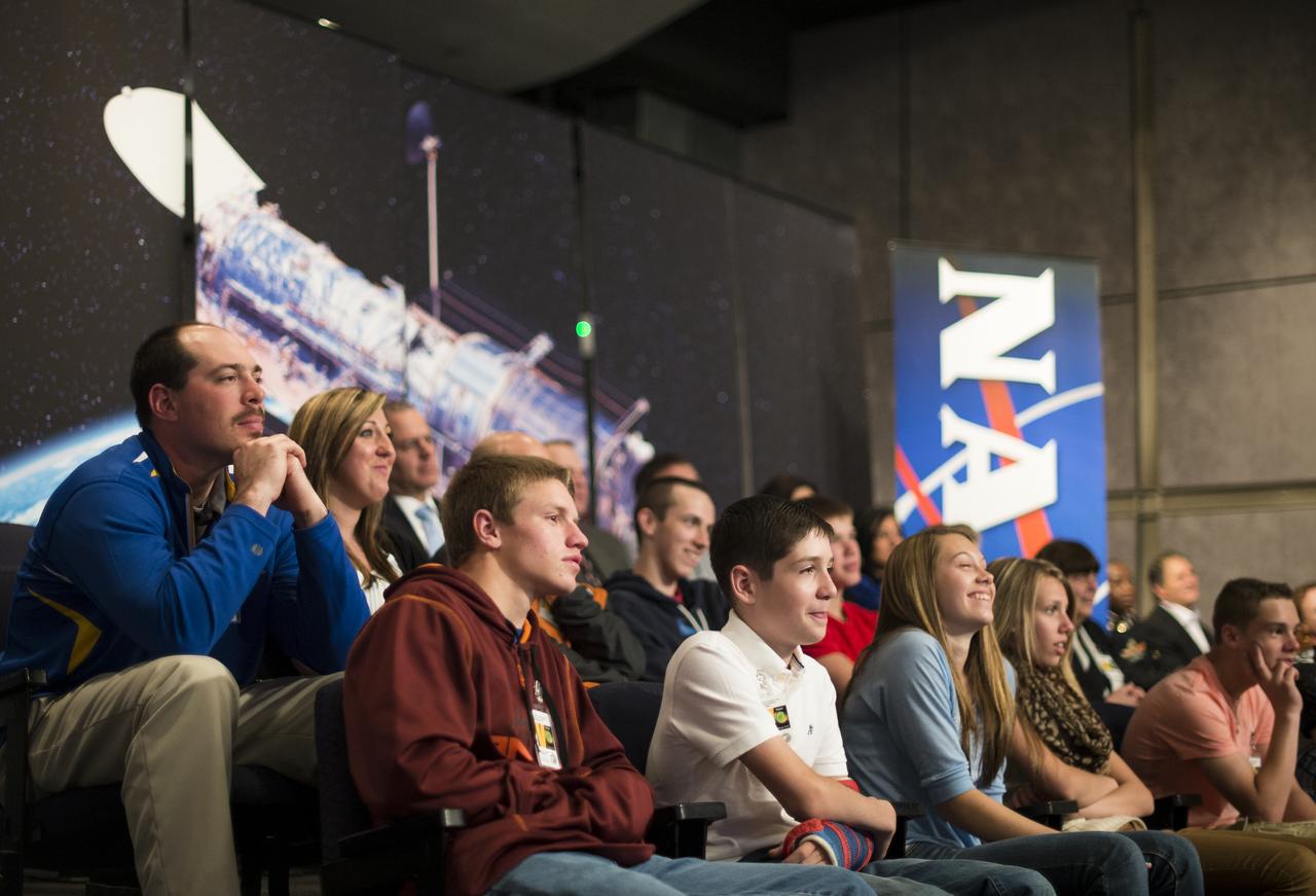 Students and faculty from Mapletown Jr/Sr High School and Margaret Bell Middle School listen as John Grunsfeld, NASA Associate Administrator for the Science Mission Directorate, speaks about his experiences on the final space shuttle servicing mission to the Hubble Space Telescope during the NASA Hubble Space Telescope (HST) Research Project Capstone Event in the James E. Webb Auditorium at NASA Headquarters on Monday, May 5, 2014.  Photo Credit: (NASA/Joel Kowsky)