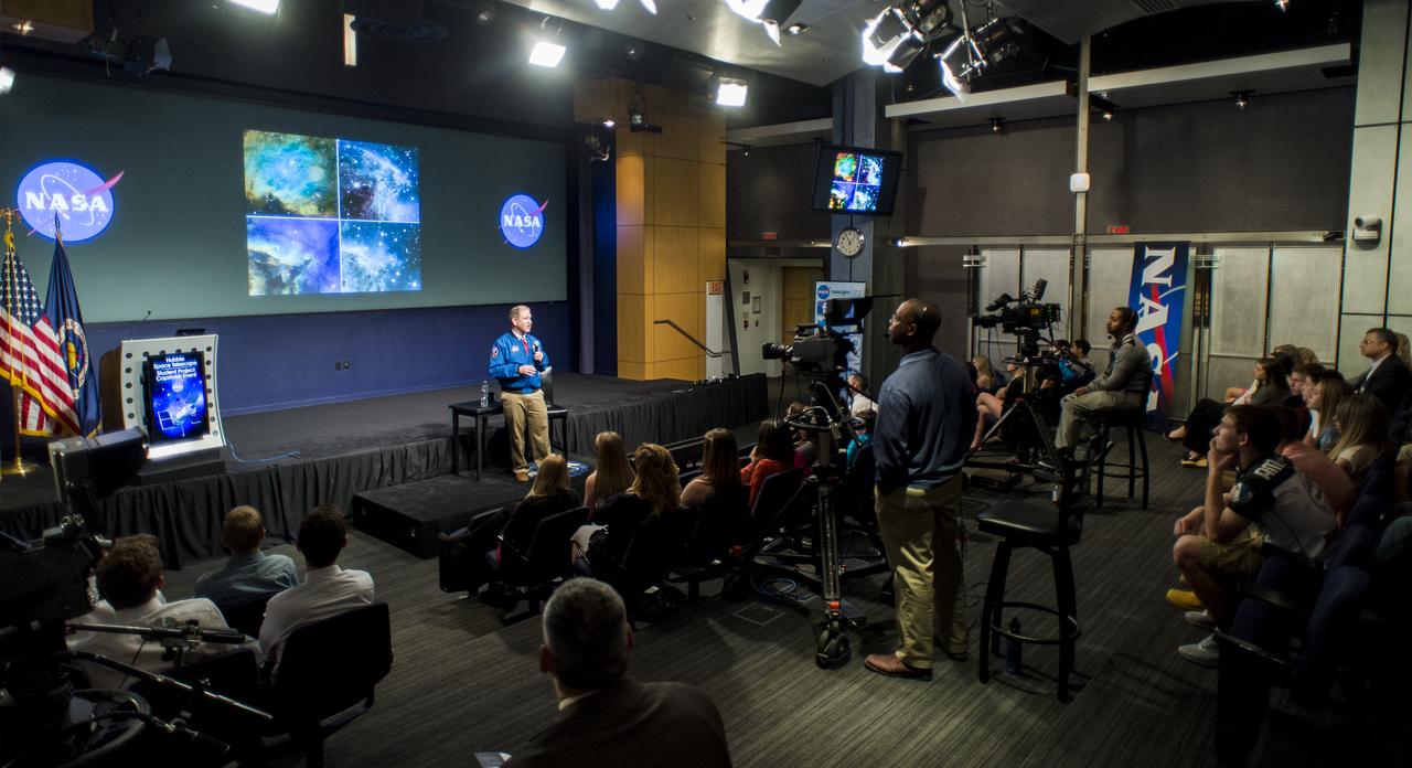 John Grunsfeld, NASA Associate Administrator for the Science Mission Directorate, speaks to students from Mapletown Jr/Sr High School and Margaret Bell Middle School about his experiences on the final space shuttle servicing mission to the Hubble Space Telescope during the NASA Hubble Space Telescope (HST) Research Project Capstone Event in the James E. Webb Auditorium at NASA Headquarters on Monday, May 5, 2014. Grunsfeld flew on three of the five servicing missions to the Hubble Space Telescope.  Photo Credit: (NASA/Joel Kowsky)