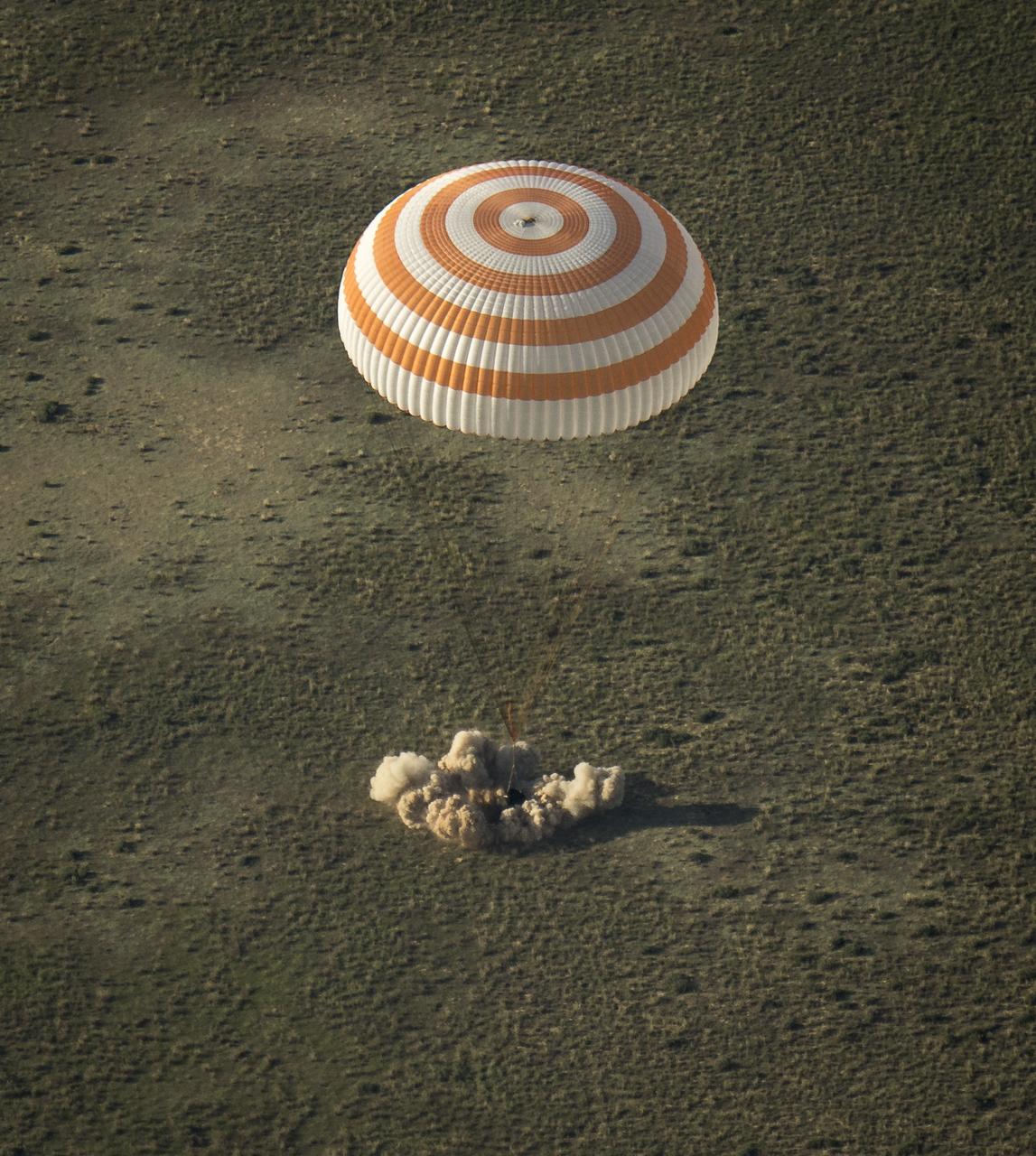 The Soyuz TMA-11M spacecraft is seen as it lands with Expedition 39 Commander Koichi Wakata of the Japan Aerospace Exploration Agency (JAXA), Soyuz Commander Mikhail Tyurin of Roscosmos, and Flight Engineer Rick Mastracchio of NASA near the town of Zhezkazgan, Kazakhstan on Wednesday, May 14, 2014. Wakata, Tyurin and Mastracchio returned to Earth after more than six months onboard the International Space Station where they served as members of the Expedition 38 and 39 crews. Photo Credit: (NASA/Bill Ingalls)