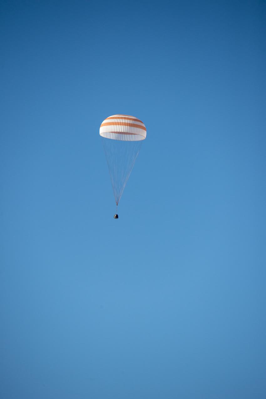 The Soyuz TMA-11M spacecraft is seen as it lands with Expedition 39 Commander Koichi Wakata of the Japan Aerospace Exploration Agency (JAXA), Soyuz Commander Mikhail Tyurin of Roscosmos, and Flight Engineer Rick Mastracchio of NASA near the town of Zhezkazgan, Kazakhstan on Wednesday, May 14, 2014. Wakata, Tyurin and Mastracchio returned to Earth after more than six months onboard the International Space Station where they served as members of the Expedition 38 and 39 crews. Photo Credit: (NASA/Bill Ingalls)