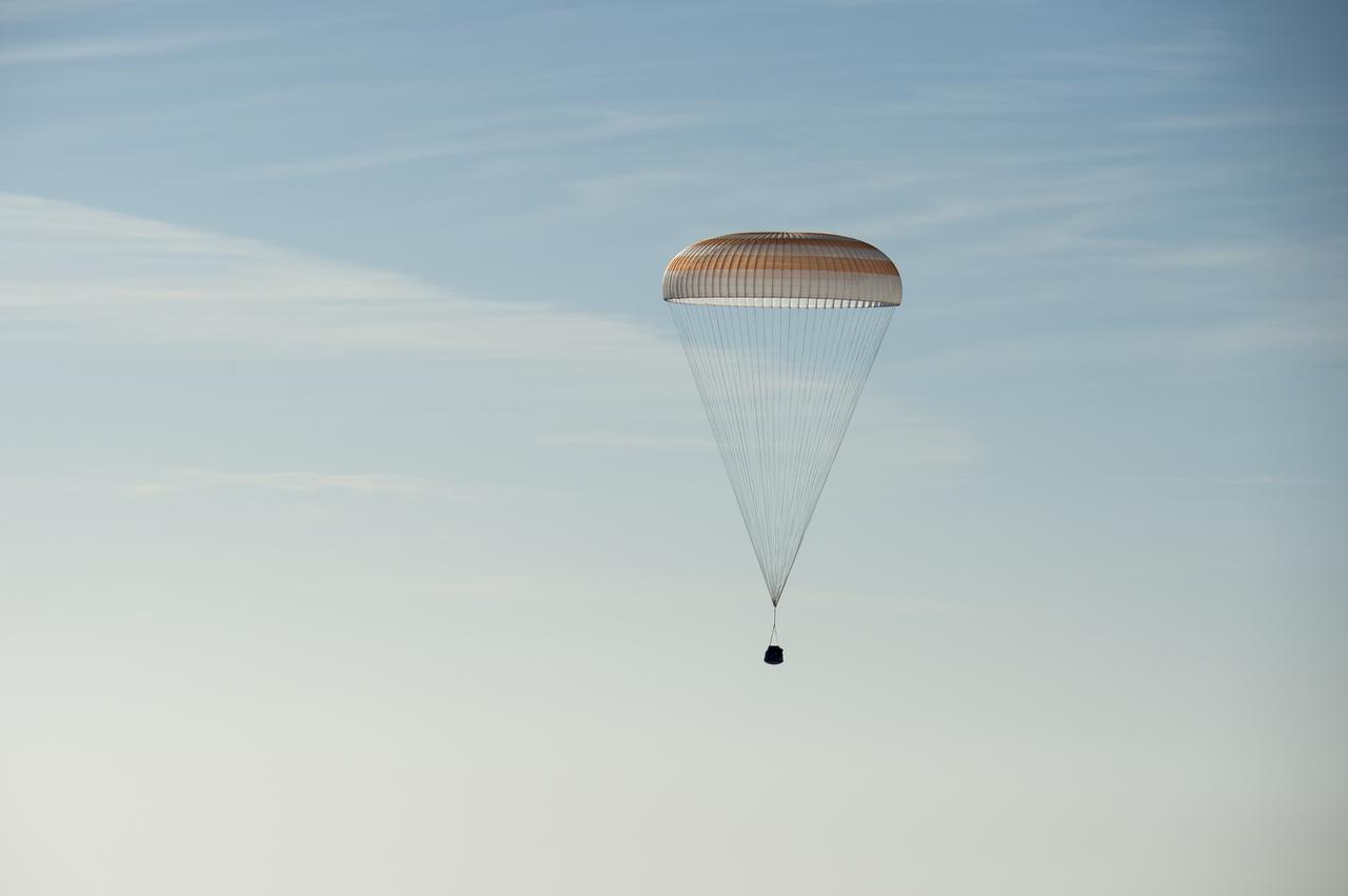 The Soyuz TMA-11M spacecraft is seen as it lands with Expedition 39 Commander Koichi Wakata of the Japan Aerospace Exploration Agency (JAXA), Soyuz Commander Mikhail Tyurin of Roscosmos, and Flight Engineer Rick Mastracchio of NASA near the town of Zhezkazgan, Kazakhstan on Wednesday, May 14, 2014. Wakata, Tyurin and Mastracchio returned to Earth after more than six months onboard the International Space Station where they served as members of the Expedition 38 and 39 crews. Photo Credit: (NASA/Bill Ingalls)