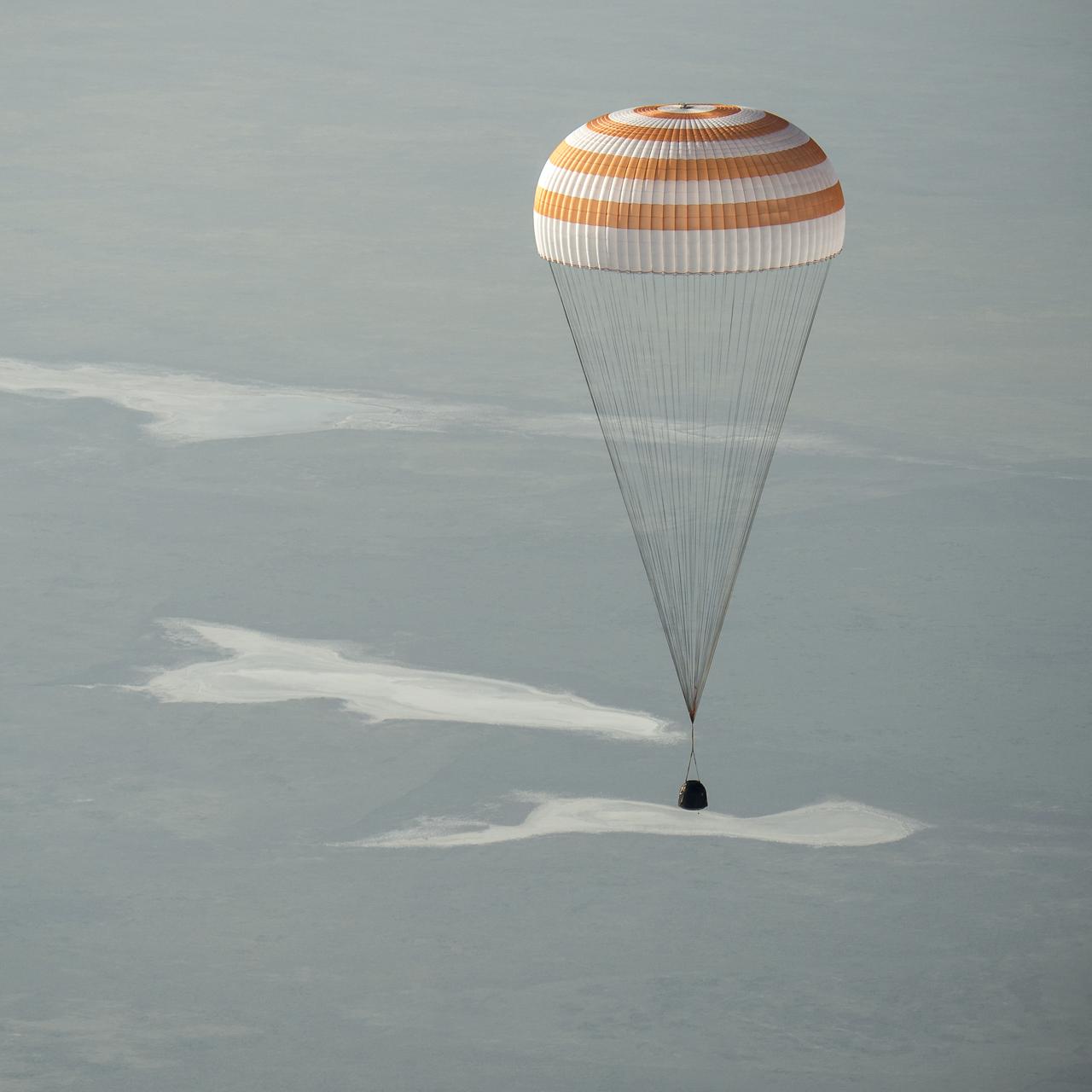 The Soyuz TMA-11M spacecraft is seen as it lands with Expedition 39 Commander Koichi Wakata of the Japan Aerospace Exploration Agency (JAXA), Soyuz Commander Mikhail Tyurin of Roscosmos, and Flight Engineer Rick Mastracchio of NASA near the town of Zhezkazgan, Kazakhstan on Wednesday, May 14, 2014. Wakata, Tyurin and Mastracchio returned to Earth after more than six months onboard the International Space Station where they served as members of the Expedition 38 and 39 crews. Photo Credit: (NASA/Bill Ingalls)
