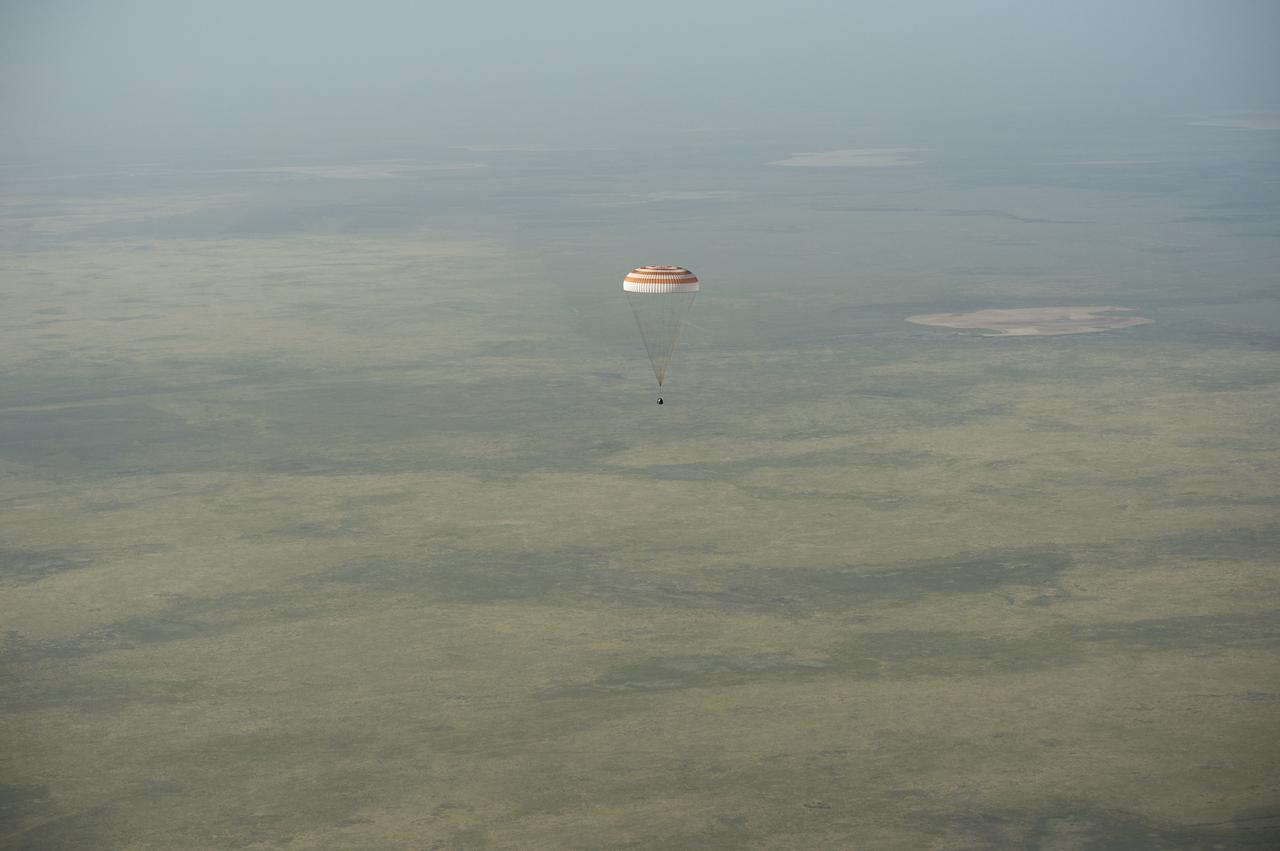 The Soyuz TMA-11M spacecraft is seen as it lands with Expedition 39 Commander Koichi Wakata of the Japan Aerospace Exploration Agency (JAXA), Soyuz Commander Mikhail Tyurin of Roscosmos, and Flight Engineer Rick Mastracchio of NASA near the town of Zhezkazgan, Kazakhstan on Wednesday, May 14, 2014. Wakata, Tyurin and Mastracchio returned to Earth after more than six months onboard the International Space Station where they served as members of the Expedition 38 and 39 crews. Photo Credit: (NASA/Bill Ingalls)