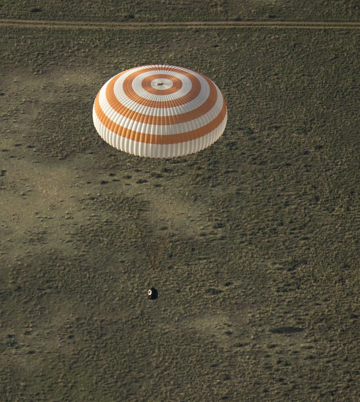 The Soyuz TMA-11M spacecraft is seen as it lands with Expedition 39 Commander Koichi Wakata of the Japan Aerospace Exploration Agency (JAXA), Soyuz Commander Mikhail Tyurin of Roscosmos, and Flight Engineer Rick Mastracchio of NASA near the town of Zhezkazgan, Kazakhstan on Wednesday, May 14, 2014. Wakata, Tyurin and Mastracchio returned to Earth after more than six months onboard the International Space Station where they served as members of the Expedition 38 and 39 crews. Photo Credit: (NASA/Bill Ingalls)