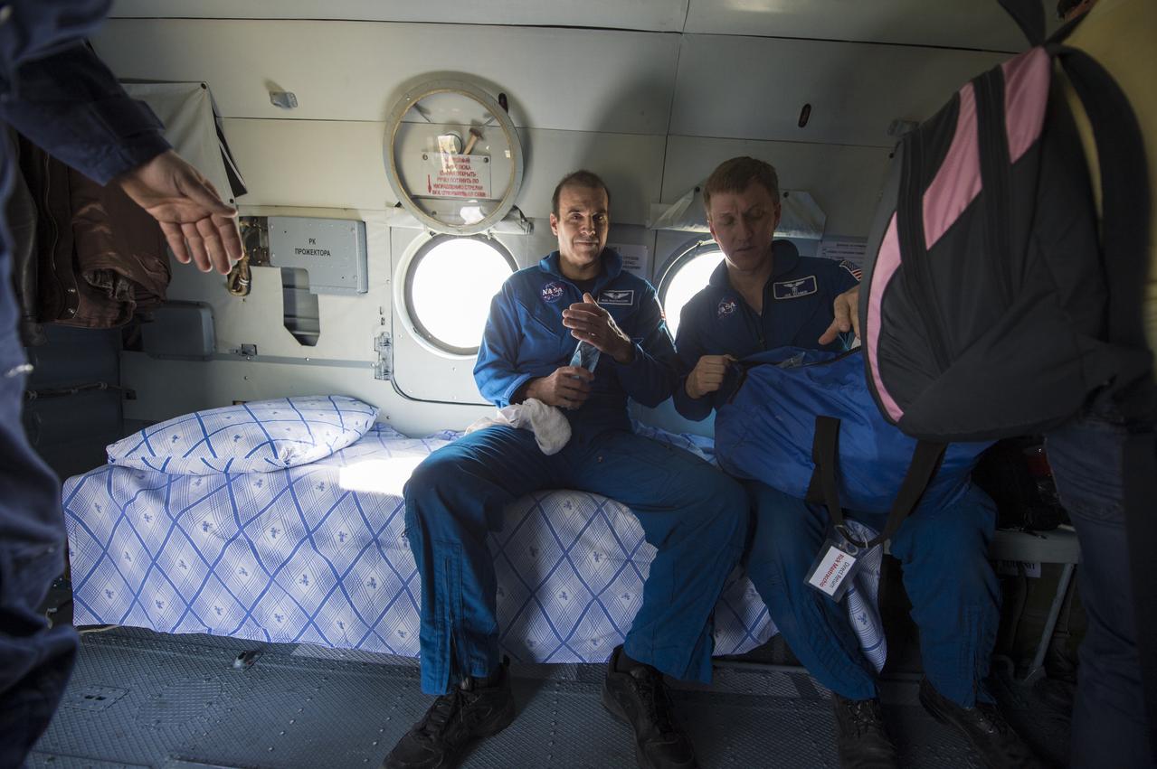 Expedition 39 Flight Engineer Rick Mastracchio of NASA, left, and NASA Flight Surgeon Joseph Schmid prepare to depart in a helicopter from the Soyuz landing site near the town of Zhezkazgan, Kazakhstan where Mastracchio and Expedition 39 Commander Koichi Wakata of the Japan Aerospace Exploration Agency (JAXA), and Soyuz Commander Mikhail Tyurin of Roscosmos landed in their Soyuz TMA-11M spacecraft, Wednesday, May 14, 2014. Wakata, Tyurin and Mastracchio returned to Earth after more than six months onboard the International Space Station where they served as members of the Expedition 38 and 39 crews. Photo Credit: (NASA/Bill Ingalls)