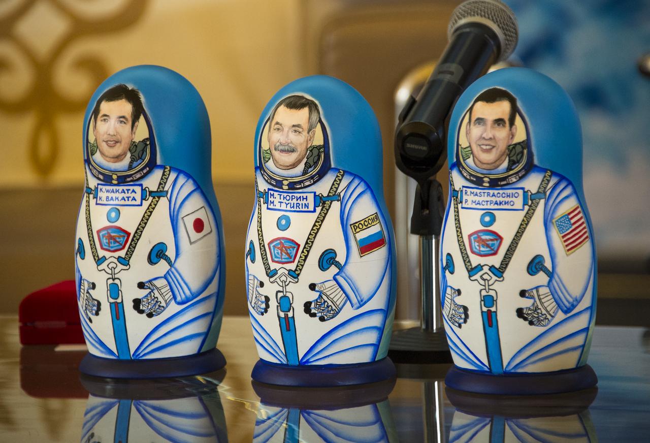 Matryoshka Dolls depicting Expedition 39 Commander Koichi Wakata of the Japan Aerospace Exploration Agency (JAXA), left, Soyuz Commander Mikhail Tyurin of Roscosmos, center, and Flight Engineer Rick Mastracchio of NASA are seen at a welcome ceremony, Wednesday, May 14, 2014 at the Karaganda Airport in Kazakhstan. Wakata, Tyurin and Mastracchio returned to Earth after more than six months onboard the International Space Station where they served as members of the Expedition 38 and 39 crews. Photo Credit: (NASA/Bill Ingalls)