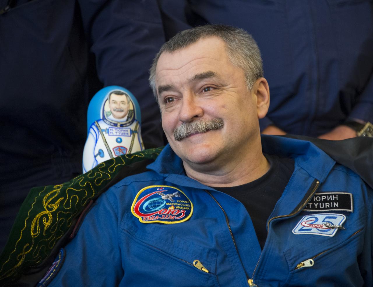 Expedition 39 Soyuz Commander Mikhail Tyurin of Roscosmos smiles during a welcome home ceremony, Wednesday, May 14, 2014 at the Karaganda Airport in Kazakhstan. Tyurin, Expedition 39 Commander Koichi Wakata of the Japan Aerospace Exploration Agency (JAXA), and Flight Engineer Rick Mastracchio of NASA landed in their Soyuz TMA-11M spacecraft just a few hours earlier near the town of Zhezkazgan. Wakata, Tyurin and Mastracchio returned to Earth after more than six months onboard the International Space Station where they served as members of the Expedition 38 and 39 crews. Photo Credit: (NASA/Bill Ingalls)
