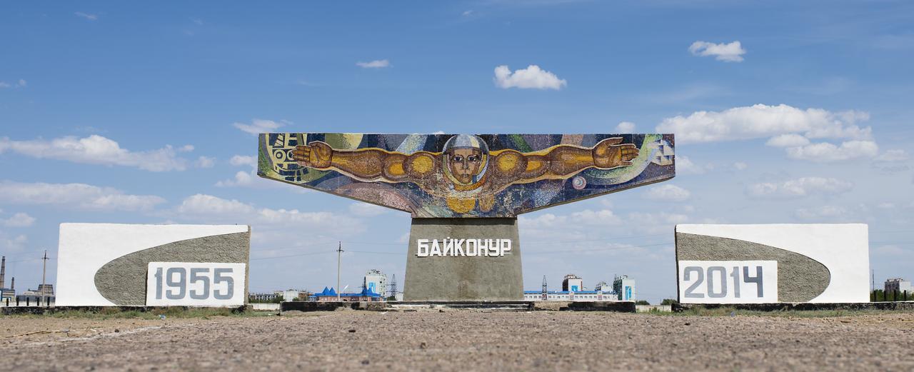 A space themed mural made of tile is seen at the entrance to the town of Baikonur, Kazakhstan on Sunday, May 25, 2014. Launch of a Soyuz rocket to the International Space Station (ISS) with Expedition 40/41 Soyuz Commander Maxim Suraev of the Russian Federal Space Agency, Roscosmos, Flight Engineer Alexander Gerst of the European Space Agency, ESA, and Flight Engineer Reid Wiseman of NASA is scheduled for Thursday May 29, Kazakh time. The mural provided the inspiration for the Soyuz TMA-13M crew patch that the trio will be wearing. Photo Credit: (NASA/Joel Kowsky)
