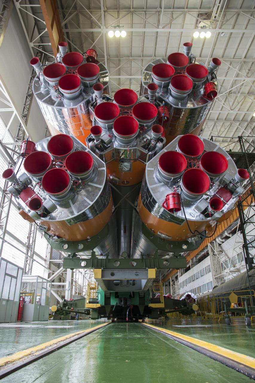 The Soyuz rocket and Soyuz TMA-13M spacecraft is assembled at Building 112 on the Baikonur Cosmodrome on Sunday, May 25, 2014 in Baikonur, Kazakhstan. Launch of the Soyuz is scheduled for May 29 and will send Expedition 40 Soyuz Commander Maxim Suraev of the Russian Federal Space Agency, Roscosmos, Flight Engineer Alexander Gerst of the European Space Agency, ESA, and Flight Engineer Reid Wiseman of NASA to the International Space Station for a five and a half month stay.  Photo Credit: (NASA/Victor Zelentsov)