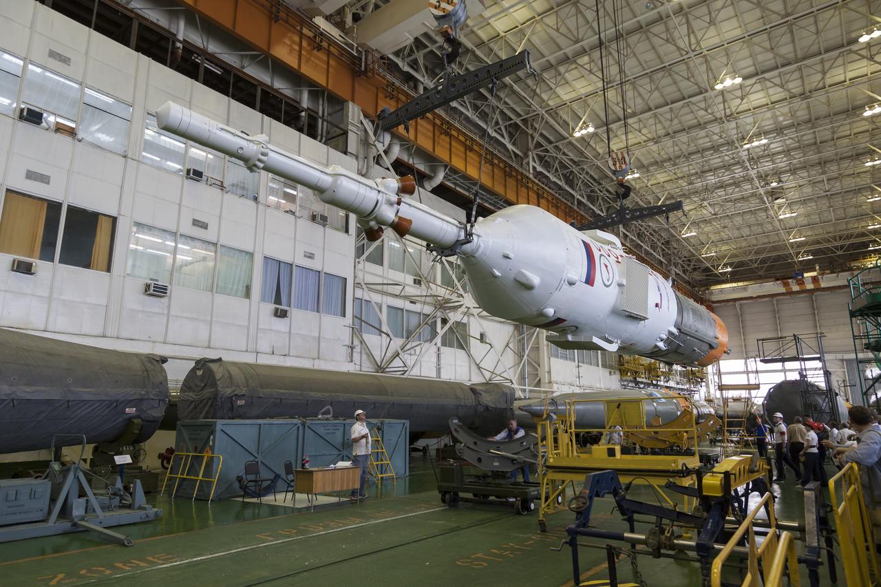 The Soyuz rocket and Soyuz TMA-13M spacecraft is assembled at Building 112 on the Baikonur Cosmodrome on Sunday, May 25, 2014 in Baikonur, Kazakhstan. Launch of the Soyuz is scheduled for May 29 and will send Expedition 40 Soyuz Commander Maxim Suraev of the Russian Federal Space Agency, Roscosmos, Flight Engineer Alexander Gerst of the European Space Agency, ESA, and Flight Engineer Reid Wiseman of NASA to the International Space Station for a five and a half month stay.  Photo Credit: (NASA/Victor Zelentsov)