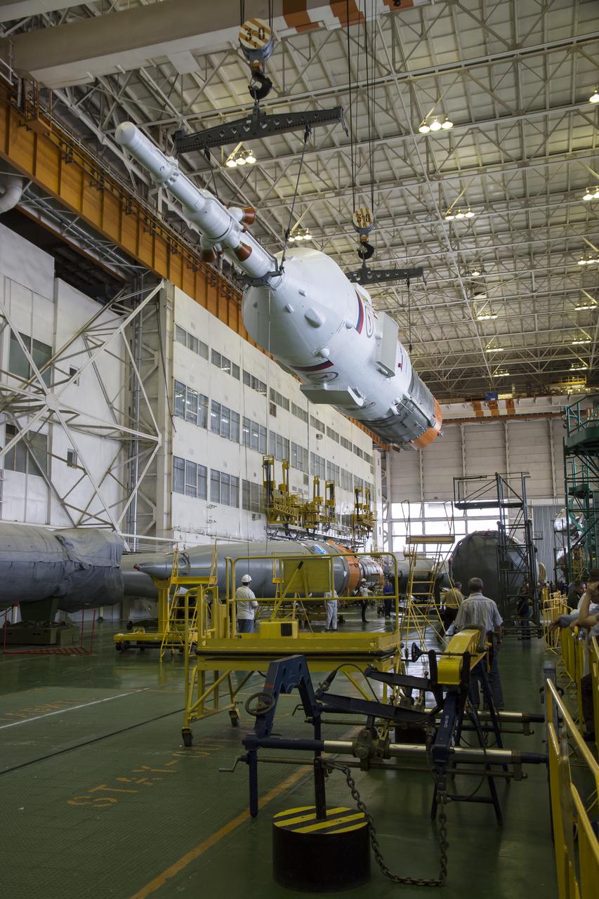 The Soyuz rocket and Soyuz TMA-13M spacecraft is assembled at Building 112 on the Baikonur Cosmodrome on Sunday, May 25, 2014 in Baikonur, Kazakhstan. Launch of the Soyuz is scheduled for May 29 and will send Expedition 40 Soyuz Commander Maxim Suraev of the Russian Federal Space Agency, Roscosmos, Flight Engineer Alexander Gerst of the European Space Agency, ESA, and Flight Engineer Reid Wiseman of NASA to the International Space Station for a five and a half month stay.  Photo Credit: (NASA/Victor Zelentsov)
