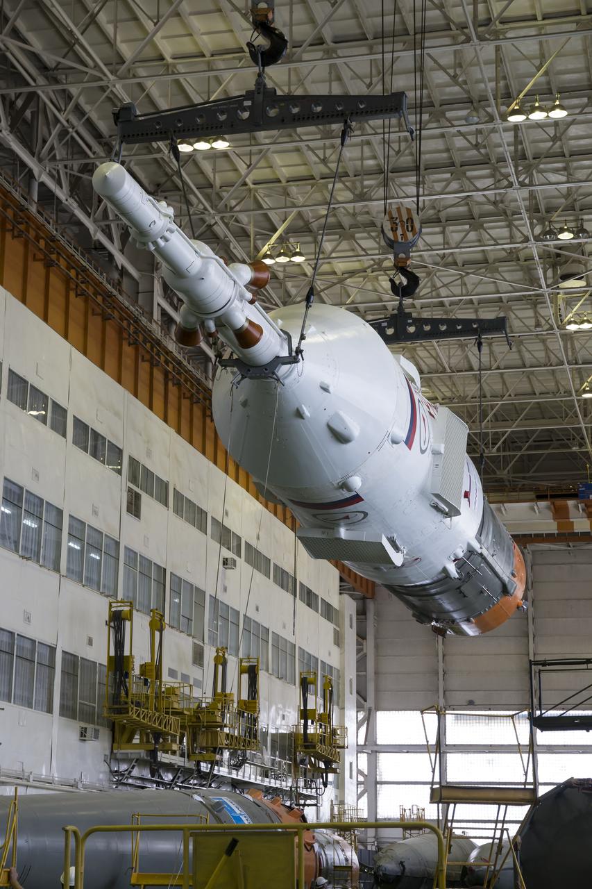 The Soyuz rocket and Soyuz TMA-13M spacecraft is assembled at Building 112 on the Baikonur Cosmodrome on Sunday, May 25, 2014 in Baikonur, Kazakhstan. Launch of the Soyuz is scheduled for May 29 and will send Expedition 40 Soyuz Commander Maxim Suraev of the Russian Federal Space Agency, Roscosmos, Flight Engineer Alexander Gerst of the European Space Agency, ESA, and Flight Engineer Reid Wiseman of NASA to the International Space Station for a five and a half month stay.  Photo Credit: (NASA/Victor Zelentsov)