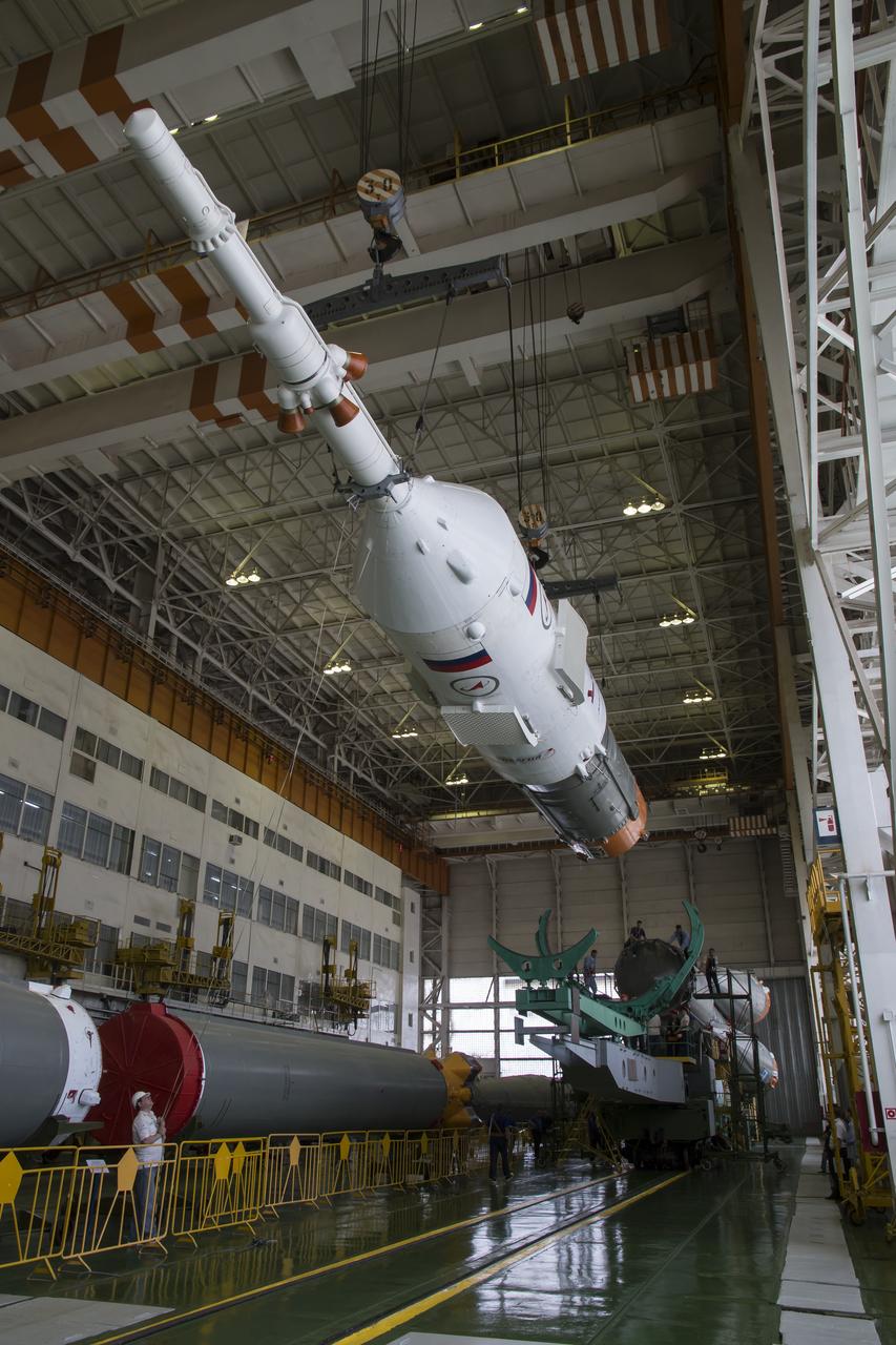 The Soyuz rocket and Soyuz TMA-13M spacecraft is assembled at Building 112 on the Baikonur Cosmodrome on Sunday, May 25, 2014 in Baikonur, Kazakhstan. Launch of the Soyuz is scheduled for May 29 and will send Expedition 40 Soyuz Commander Maxim Suraev of the Russian Federal Space Agency, Roscosmos, Flight Engineer Alexander Gerst of the European Space Agency, ESA, and Flight Engineer Reid Wiseman of NASA to the International Space Station for a five and a half month stay.  Photo Credit: (NASA/Victor Zelentsov)