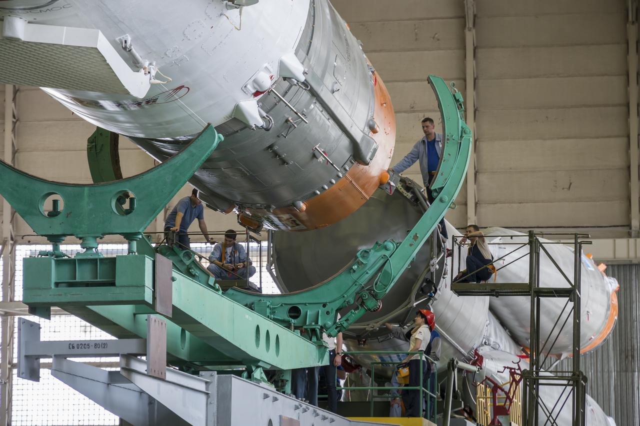 The Soyuz rocket and Soyuz TMA-13M spacecraft is assembled at Building 112 on the Baikonur Cosmodrome on Sunday, May 25, 2014 in Baikonur, Kazakhstan. Launch of the Soyuz is scheduled for May 29 and will send Expedition 40 Soyuz Commander Maxim Suraev of the Russian Federal Space Agency, Roscosmos, Flight Engineer Alexander Gerst of the European Space Agency, ESA, and Flight Engineer Reid Wiseman of NASA to the International Space Station for a five and a half month stay. Photo Credit: (NASA/Victor Zelentsov)