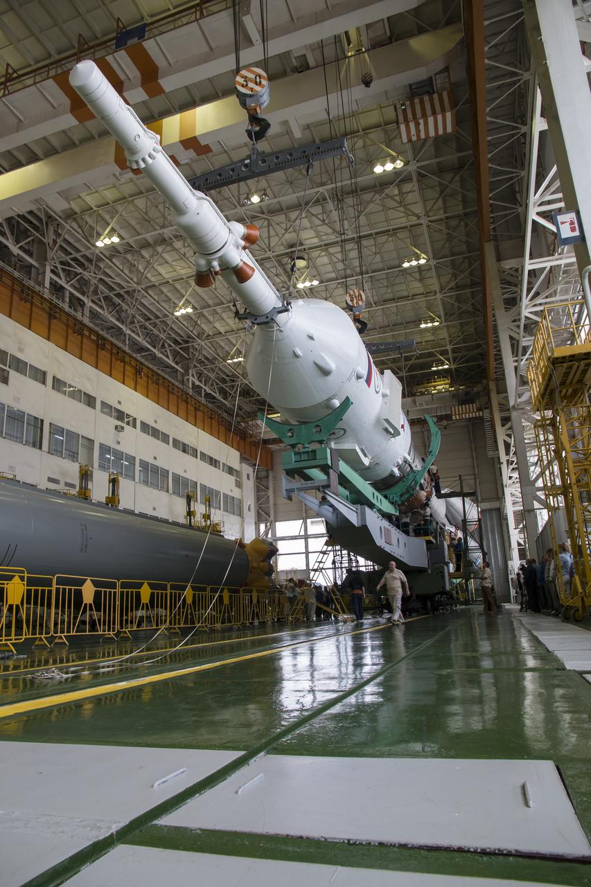 The Soyuz rocket and Soyuz TMA-13M spacecraft is assembled at Building 112 on the Baikonur Cosmodrome on Sunday, May 25, 2014 in Baikonur, Kazakhstan. Launch of the Soyuz is scheduled for May 29 and will send Expedition 40 Soyuz Commander Maxim Suraev of the Russian Federal Space Agency, Roscosmos, Flight Engineer Alexander Gerst of the European Space Agency, ESA, and Flight Engineer Reid Wiseman of NASA to the International Space Station for a five and a half month stay.  Photo Credit: (NASA/Victor Zelentsov)