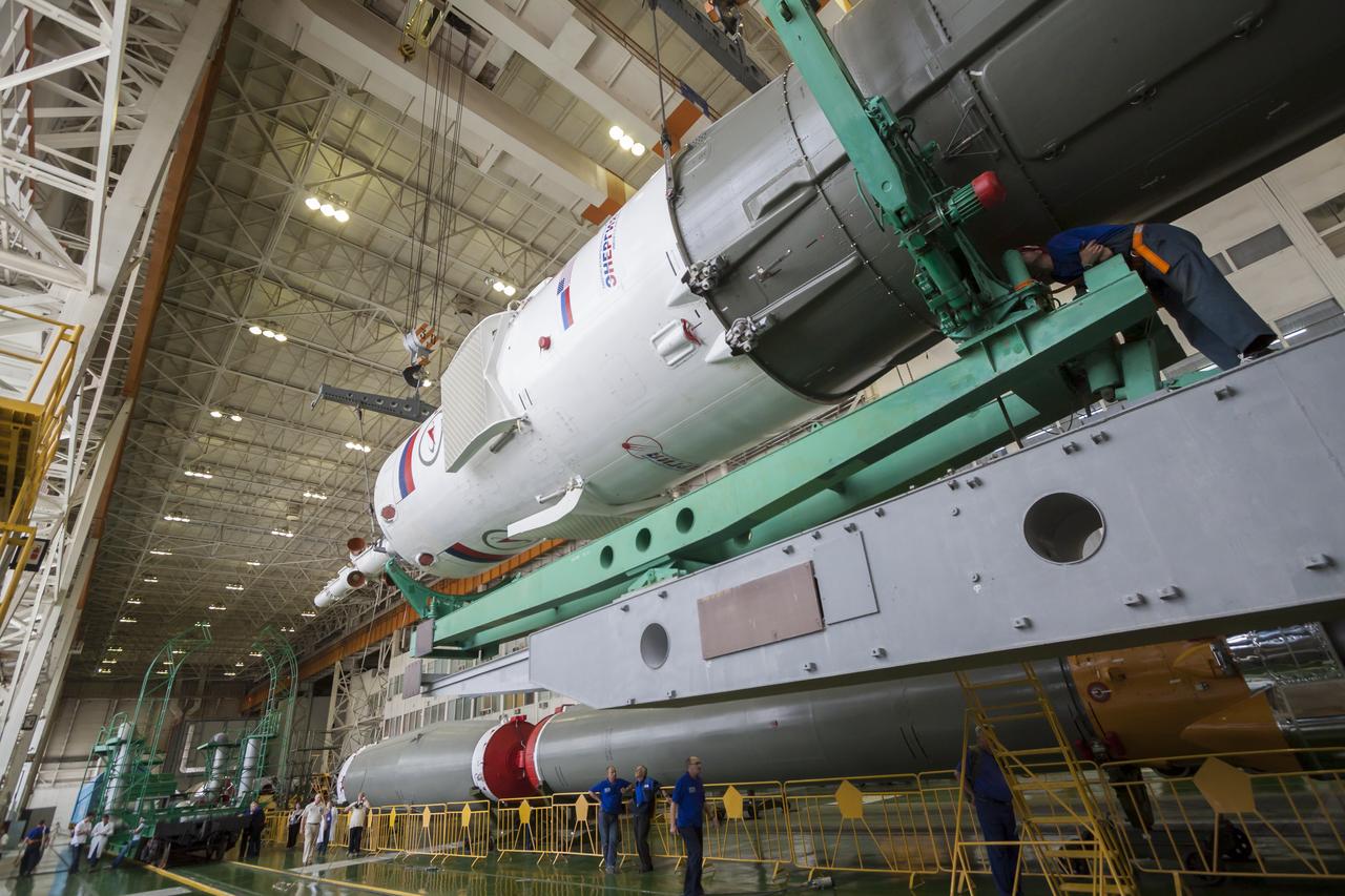 The Soyuz rocket and Soyuz TMA-13M spacecraft is assembled at Building 112 on the Baikonur Cosmodrome on Sunday, May 25, 2014 in Baikonur, Kazakhstan. Launch of the Soyuz is scheduled for May 29 and will send Expedition 40 Soyuz Commander Maxim Suraev of the Russian Federal Space Agency, Roscosmos, Flight Engineer Alexander Gerst of the European Space Agency, ESA, and Flight Engineer Reid Wiseman of NASA to the International Space Station for a five and a half month stay.  Photo Credit: (NASA/Victor Zelentsov)