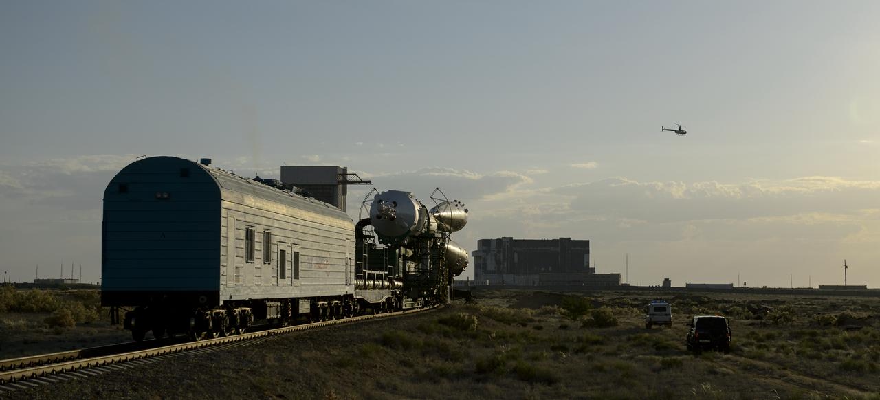 The Soyuz TMA-13M spacecraft is rolled out to the launch pad by train on Monday, May 26, 2014, at the Baikonur Cosmodrome in Kazakhstan.  Launch of the Soyuz rocket is scheduled for May 29 and will send Expedition 40 Soyuz Commander Maxim Suraev, of the Russian Federal Space Agency, Roscosmos, Flight Engineer Alexander Gerst, of the European Space Agency, ESA, and Flight Engineer Reid Wiseman of NASA on a five and a half month mission aboard the International Space Station.  Photo Credit: (NASA/Joel Kowsky)