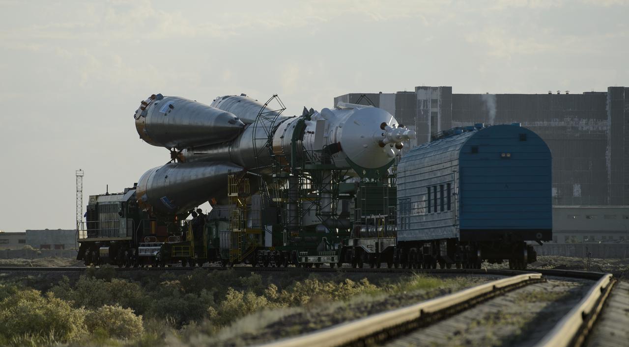 The Soyuz TMA-13M spacecraft is rolled out to the launch pad by train on Monday, May 26, 2014, at the Baikonur Cosmodrome in Kazakhstan.  Launch of the Soyuz rocket is scheduled for May 29 and will send Expedition 40 Soyuz Commander Maxim Suraev, of the Russian Federal Space Agency, Roscosmos, Flight Engineer Alexander Gerst, of the European Space Agency, ESA, and Flight Engineer Reid Wiseman of NASA on a five and a half month mission aboard the International Space Station.  Photo Credit: (NASA/Joel Kowsky)