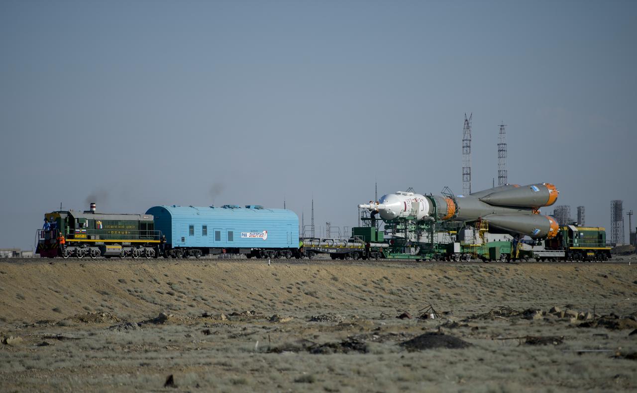 The Soyuz TMA-13M spacecraft is rolled out to the launch pad by train on Monday, May 26, 2014, at the Baikonur Cosmodrome in Kazakhstan.  Launch of the Soyuz rocket is scheduled for May 29 and will send Expedition 40 Soyuz Commander Maxim Suraev, of the Russian Federal Space Agency, Roscosmos, Flight Engineer Alexander Gerst, of the European Space Agency, ESA, and Flight Engineer Reid Wiseman of NASA on a five and a half month mission aboard the International Space Station.  Photo Credit: (NASA/Joel Kowsky)