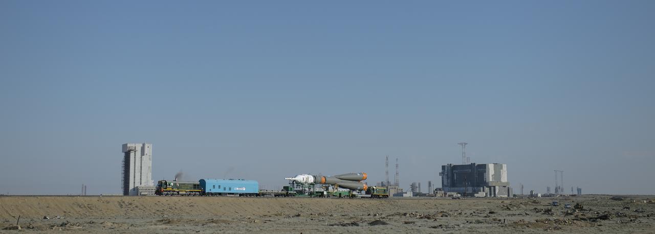 The Soyuz TMA-13M spacecraft is rolled out to the launch pad by train on Monday, May 26, 2014, at the Baikonur Cosmodrome in Kazakhstan. Launch of the Soyuz rocket is scheduled for May 29 and will send Expedition 40 Soyuz Commander Maxim Suraev, of the Russian Federal Space Agency, Roscosmos, Flight Engineer Alexander Gerst, of the European Space Agency, ESA, and Flight Engineer Reid Wiseman of NASA on a five and a half month mission aboard the International Space Station. Photo Credit: (NASA/Joel Kowsky)