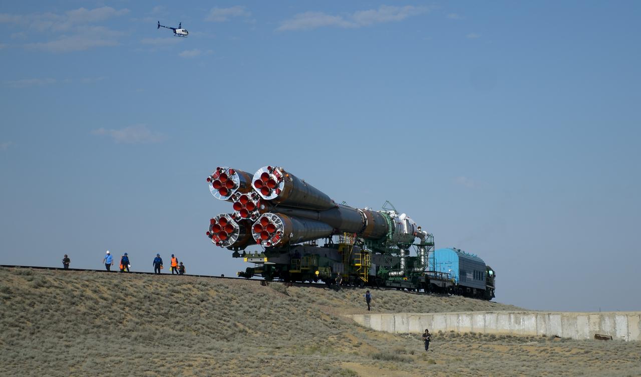 The Soyuz TMA-13M spacecraft is rolled out to the launch pad by train on Monday, May 26, 2014, at the Baikonur Cosmodrome in Kazakhstan.  Launch of the Soyuz rocket is scheduled for May 29 and will send Expedition 40 Soyuz Commander Maxim Suraev, of the Russian Federal Space Agency, Roscosmos, Flight Engineer Alexander Gerst, of the European Space Agency, ESA, and Flight Engineer Reid Wiseman of NASA on a five and a half month mission aboard the International Space Station.  Photo Credit: (NASA/Joel Kowsky)