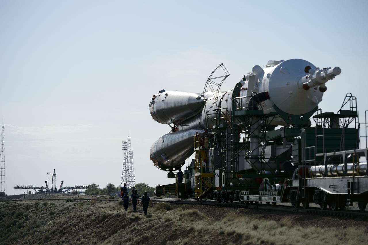 The Soyuz TMA-13M spacecraft is rolled out to the launch pad by train on Monday, May 26, 2014, at the Baikonur Cosmodrome in Kazakhstan.  Launch of the Soyuz rocket is scheduled for May 29 and will send Expedition 40 Soyuz Commander Maxim Suraev, of the Russian Federal Space Agency, Roscosmos, Flight Engineer Alexander Gerst, of the European Space Agency, ESA, and Flight Engineer Reid Wiseman of NASA on a five and a half month mission aboard the International Space Station.  Photo Credit: (NASA/Joel Kowsky)