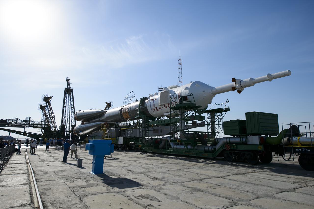The Soyuz TMA-13M spacecraft is seen shortly after arriving at the launch pad by train on Monday, May 26, 2014, at the Baikonur Cosmodrome in Kazakhstan.  Launch of the Soyuz rocket is scheduled for May 29 and will send Expedition 40 Soyuz Commander Maxim Suraev, of the Russian Federal Space Agency, Roscosmos, Flight Engineer Alexander Gerst, of the European Space Agency, ESA, and Flight Engineer Reid Wiseman of NASA on a five and a half month mission aboard the International Space Station.  Photo Credit: (NASA/Joel Kowsky)