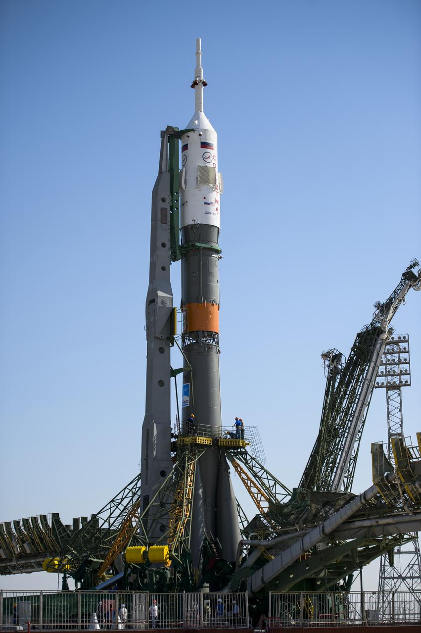 The Soyuz TMA-13M spacecraft is seen on the launch pad shortly after being raised into a vertical position on Monday, May 26, 2014, at the Baikonur Cosmodrome in Kazakhstan.  Launch of the Soyuz rocket is scheduled for May 29 and will send Expedition 40 Soyuz Commander Maxim Suraev, of the Russian Federal Space Agency, Roscosmos, Flight Engineer Alexander Gerst, of the European Space Agency, ESA, and Flight Engineer Reid Wiseman of NASA on a five and a half month mission aboard the International Space Station.  Photo Credit: (NASA/Joel Kowsky)