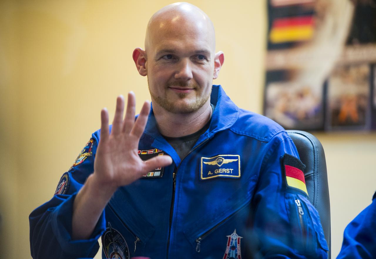 Expedition 40 Flight Engineer Alexander Gerst of the European Space Agency, ESA, is seen during a press conference, Tuesday, May 27, 2014, at the Cosmonaut Hotel in Baikonur, Kazakhstan. Expedition 40 Soyuz Commander Maxim Suraev of the Russian Federal Space Agency, Roscosmos, Flight Engineer Alexander Gerst of the European Space Agency, ESA, and Flight Engineer Reid Wiseman of NASA will launch aboard their Soyuz TMA-13M spacecraft on their mission to the International Space Station in the early hours of May 29. Photo Credit: (NASA/Joel Kowsky)