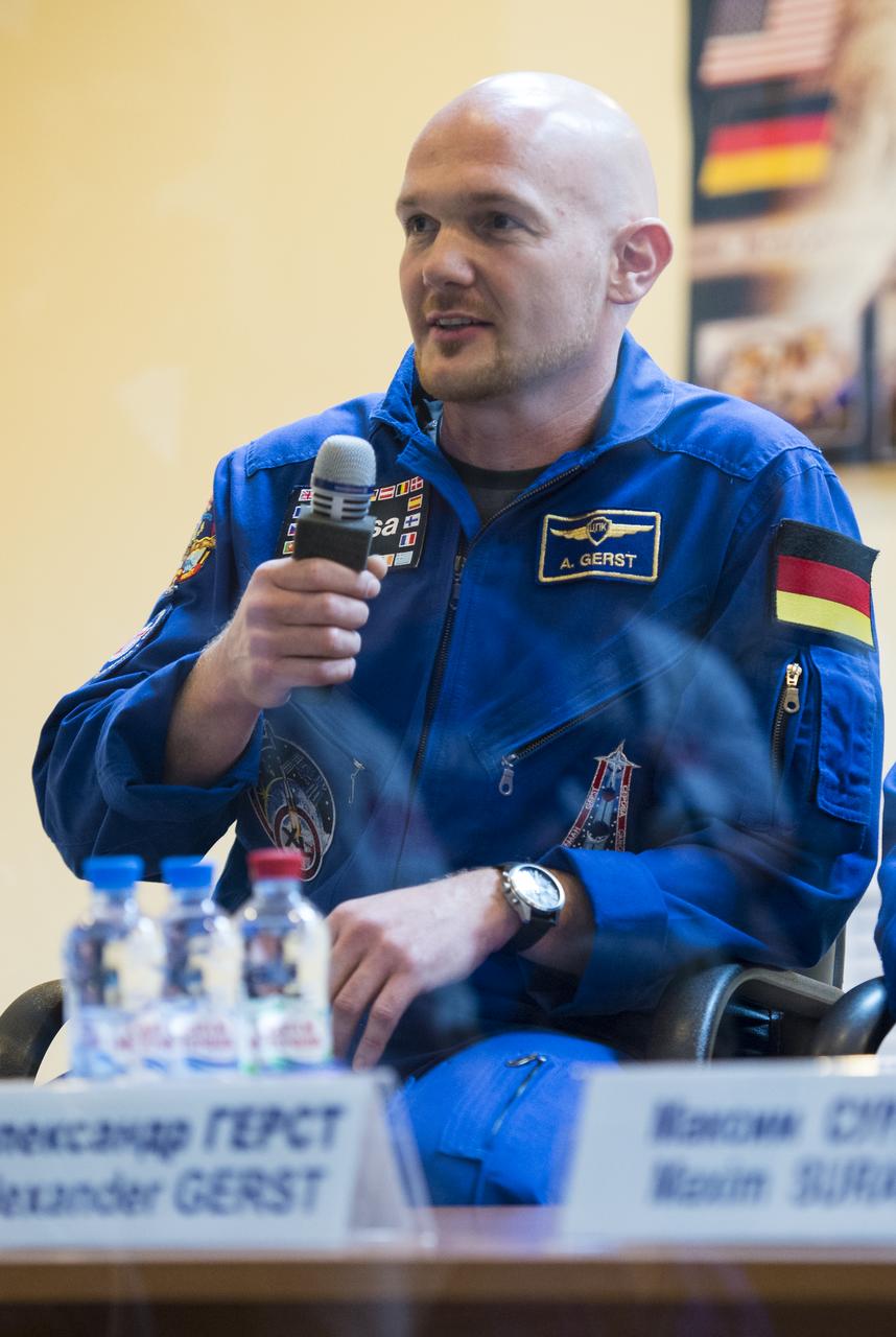 Expedition 40 Flight Engineer Alexander Gerst of the European Space Agency, ESA, speaks during a press conference, Tuesday, May 27, 2014, at the Cosmonaut Hotel in Baikonur, Kazakhstan. Expedition 40 Soyuz Commander Maxim Suraev of the Russian Federal Space Agency, Roscosmos, Flight Engineer Alexander Gerst of the European Space Agency, ESA, and Flight Engineer Reid Wiseman of NASA will launch aboard their Soyuz TMA-13M spacecraft on their mission to the International Space Station in the early hours of May 29. Photo Credit: (NASA/Joel Kowsky)