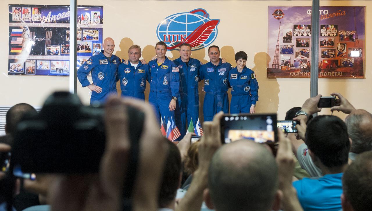 Expedition 40 prime crew members Flight Engineer Alexander Gerst of the European Space Agency, ESA, far left, Soyuz Commander Maxim Suraev of the Russian Federal Space Agency, Roscosmos, second left, and Flight Engineer Reid Wiseman of NASA, center, are seen with Expedition 40 backup crew members Flight Engineer Terry Virts of NASA, third right, Soyuz Commander Anton Shkaplerov of Roscosmos, and Flight Engineer Samantha Cristoforetti of ESA during a press conference, Tuesday, May 27, 2014, at the Cosmonaut Hotel in Baikonur, Kazakhstan. The mission to the International Space Station is set to launch May 29 from the Baikonur Cosmodrome. Photo Credit: (NASA/Joel Kowsky)