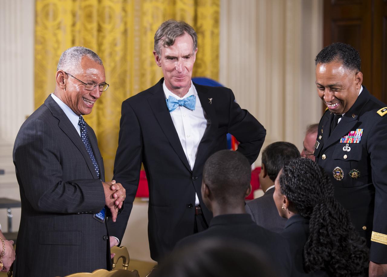 NASA Administrator Charles Bolden (left) and Bill Nye, The Science Guy, speak with some students that participated in the White House Science Fair. The fourth White House Science Fair was held at the White House on May 27, 2014 and included 100 students from more than 30 different states who competed in science, technology, engineering, and math (STEM) competitions. (Photo Credit: NASA/Aubrey Gemignani)