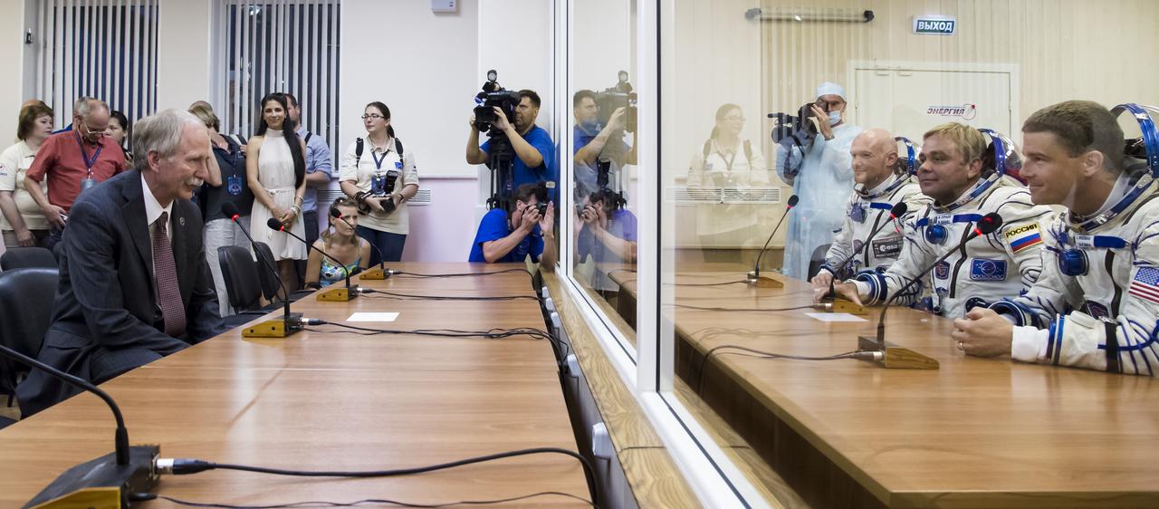 William Gerstenmaier, NASA Associate Administrator for Human Exploration and Operations, left, is seen speaking with Expedition 40 Flight Engineer Alexander Gerst of the European Space Agency, ESA, back right, Soyuz Commander Maxim Suraev of the Russian Federal Space Agency, Roscosmos, center right, and Flight Engineer Reid Wiseman of NASA, front right, following Russian Sokol suit pressure checks in preparation for their launch onboard the Soyuz TMA-13M spacecraft, Wednesday, May 28, 2014 at the Baikonur Cosmodrome in Kazakhstan. Gerst, Suraev, and Wiseman will spend five and a half months living and working on board the International Space Station. Photo Credit: (NASA/Victor Zelentsov)