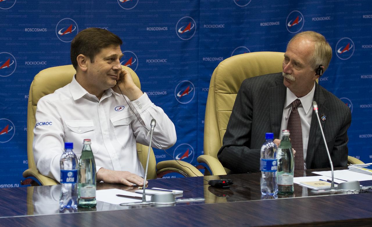 General Director of the Russian Federal Space Agency, Roscosmos, left, and William Gerstenmaier, NASA Associate Administrator for Human Exploration and Operations, right, are seen during a joint statement after the docking of the Soyuz TMA-13M spacecraft with the International Space Station on Thursday, May 29, 2014 at the Baikonur Hotel in Baikonur, Kazakhstan.  Photo Credit: (NASA/Joel Kowsky)