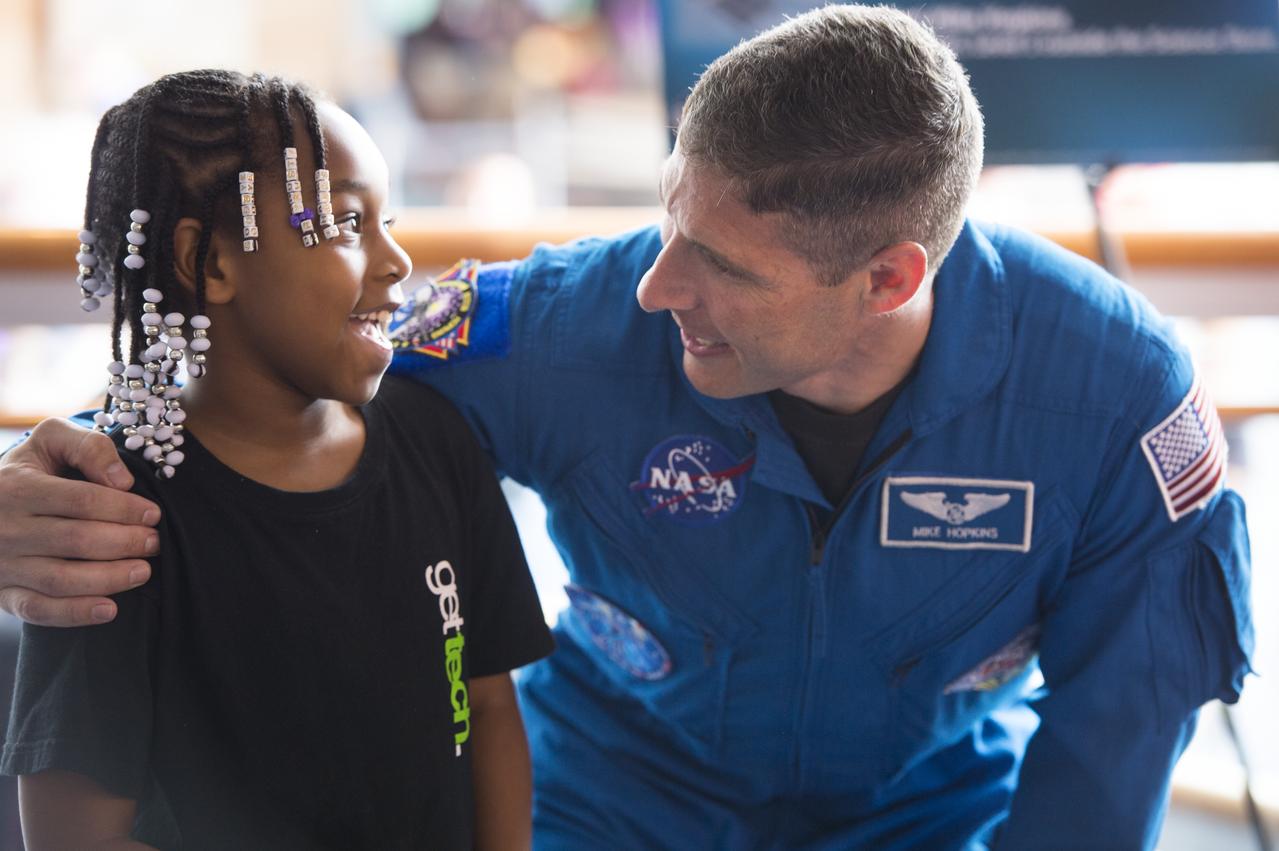 NASA Astronaut Mike Hopkins explains what it was like to live on the International Space Station for 6 months to visitors at the Maryland Science Center in Baltimore, MD on Monday, June 9, 2014. Hopkins served on Expeditions 37 and 38 with Russian cosmonauts Oleg Kotov and Sergey Ryazanskiy and returned home in March, 2014.  (Photo Credit: NASA/Aubrey Gemignani)