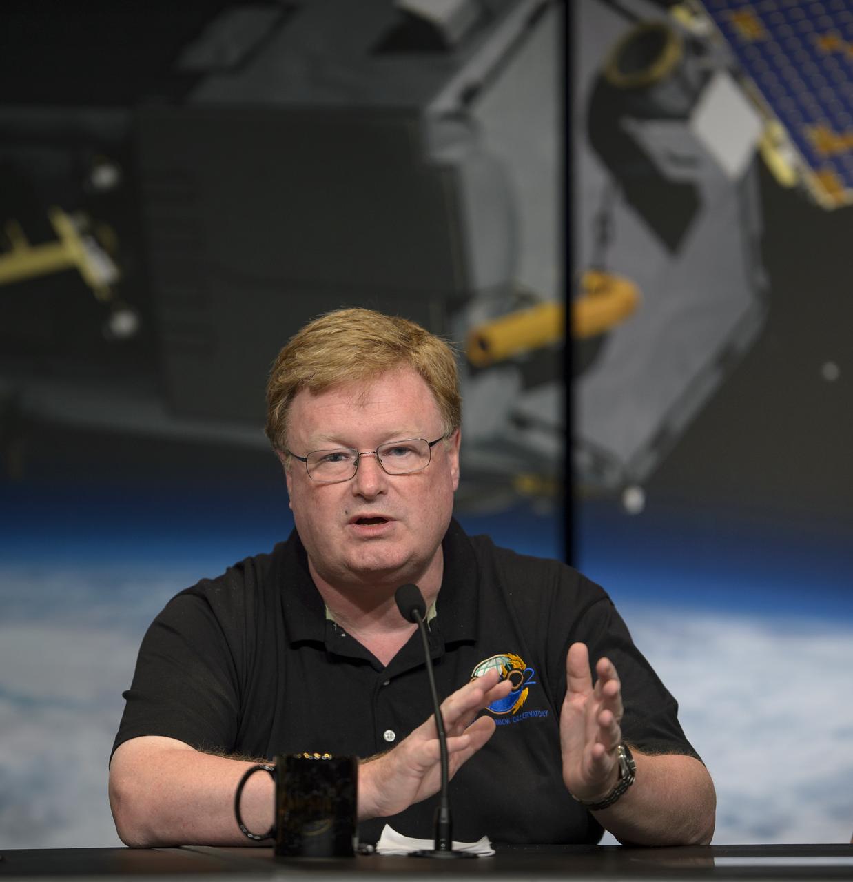 Mike Gunson, OCO-2 project scientist with NASA’s Jet Propulsion Laboratory (JPL) in Pasadena, California, discusses the Orbiting Carbon Observatory-2 (OCO-2), NASA’s first spacecraft dedicated to studying carbon dioxide, during a press briefing, Thursday, June 12, 2014, at NASA Headquarters in Washington. OCO-2 is set for a July 1, 2014 launch from Vandenberg Air Force Base in California. Its mission is to measure the global distribution of carbon dioxide, the leading human-produced greenhouse gas driving changes in Earth’s climate.  Photo Credit: (NASA/Bill Ingalls)