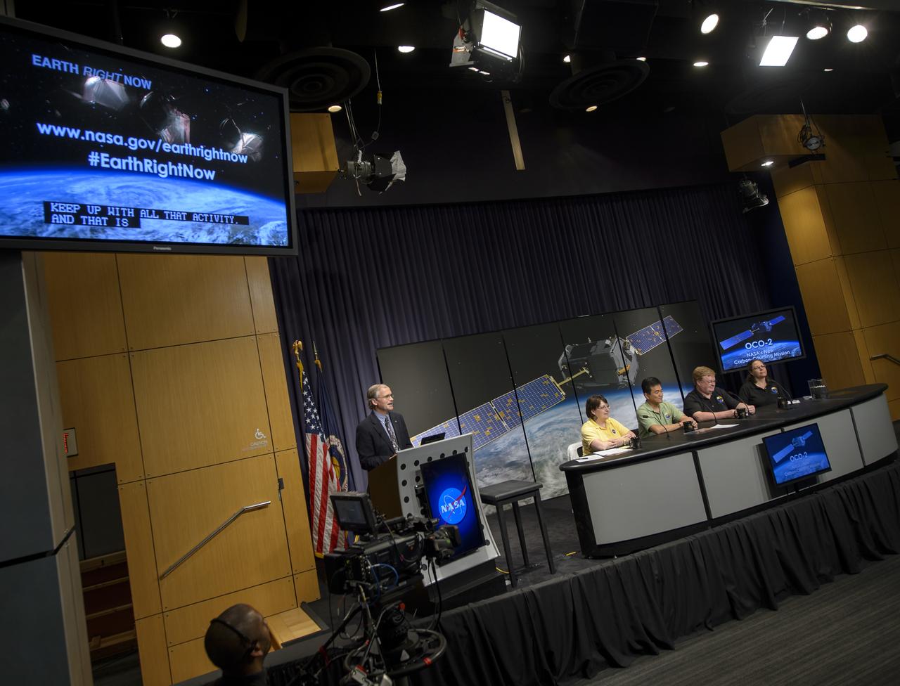 NASA Headquarters Public Affairs Officer Steve Cole, standing, moderates a Orbiting Carbon Observatory-2 (OCO-2) briefing with (from left), Betsy Edwards, OCO-2 program executive with the Science Mission Directorate at NASA Headquarters, Ralph Basilio, OCO-2 project manager with NASA’s Jet Propulsion Laboratory (JPL) in Pasadena, California, Mike Gunson, OCO-2 project scientist with JPL, and Annmarie Eldering, OCO-2 deputy project scientist JPL, , Thursday, June 12, 2014, at NASA Headquarters in Washington. OCO-2, NASA’s first spacecraft dedicated to studying carbon dioxide, is set for a July 1, 2014 launch from Vandenberg Air Force Base in California. Its mission is to measure the global distribution of carbon dioxide, the leading human-produced greenhouse gas driving changes in Earth’s climate.  Photo Credit: (NASA/Bill Ingalls)
