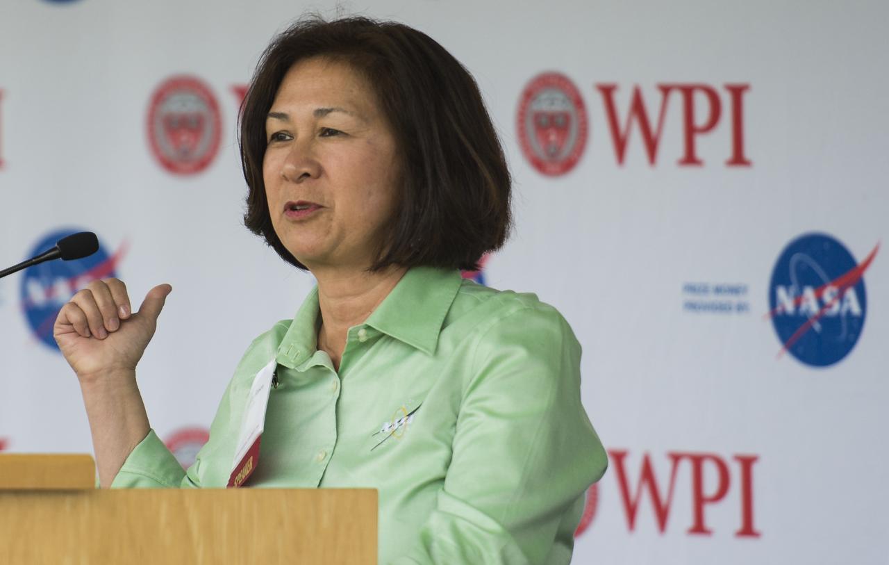 Dorothy Rasco, NASA Deputy Associate Administrator for the Space Technology Mission Directorate, speaks at the TouchTomorrow Festival, held in conjunction with the 2014 NASA Centennial Challenges Sample Return Robot Challenge, Saturday, June 14, 2014, at the Worcester Polytechnic Institute (WPI) in Worcester, Mass.   Eighteen teams are competing for a $1.5 million NASA prize purse. Teams will be required to demonstrate autonomous robots that can locate and collect samples from a wide and varied terrain, operating without human control. The objective of this NASA-WPI Centennial Challenge is to encourage innovations in autonomous navigation and robotics technologies. Innovations stemming from the challenge may improve NASA's capability to explore a variety of destinations in space, as well as enhance the nation's robotic technology for use in industries and applications on Earth. Photo Credit: (NASA/Joel Kowsky)