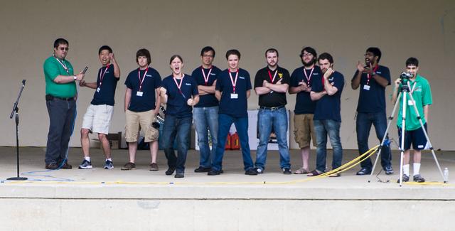 Members of the Mountaineers team from West Virginia University celebrate after their robot returned to the starting platform after picking up the sample during a rerun of the level one challenge during the 2014 NASA Centennial Challenges Sample Return Robot Challenge, Saturday, June 14, 2014, at the Worcester Polytechnic Institute (WPI) in Worcester, Mass.   Eighteen teams are competing for a $1.5 million NASA prize purse. Teams will be required to demonstrate autonomous robots that can locate and collect samples from a wide and varied terrain, operating without human control. The objective of this NASA-WPI Centennial Challenge is to encourage innovations in autonomous navigation and robotics technologies. Innovations stemming from the challenge may improve NASA's capability to explore a variety of destinations in space, as well as enhance the nation's robotic technology for use in industries and applications on Earth. Photo Credit: (NASA/Joel Kowsky)
