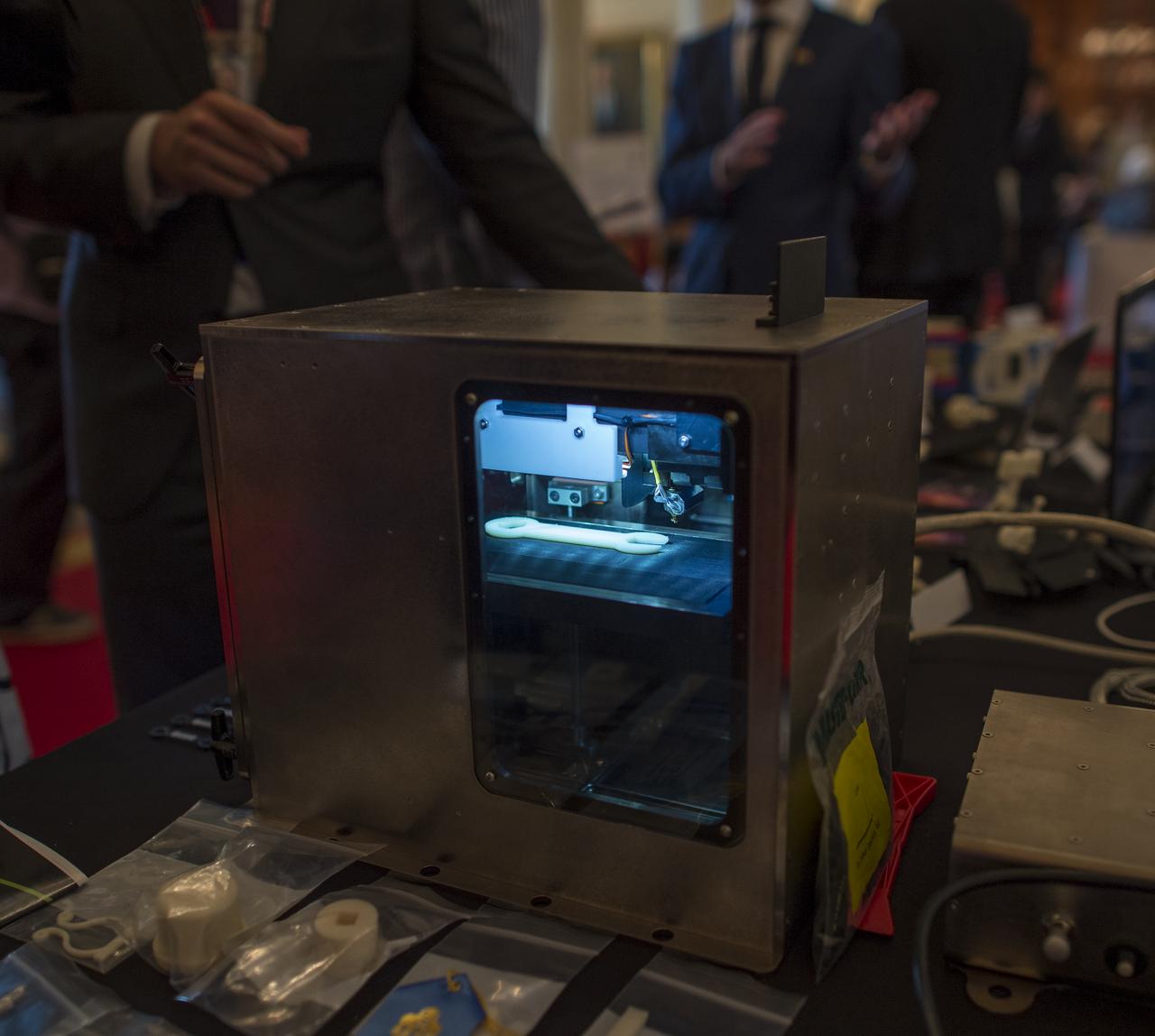A prototype model of the Made In Space 3D printer is on display during the first ever White House Maker Faire which brings together students, entrepreneurs, and everyday citizens who are using new tools and techniques to launch new businesses, learn vital skills in science, technology, engineering, and math (STEM), and fuel the renaissance in American manufacturing, at the White House, Wednesday, June 18, 2014 in Washington. The Made In Space 3D printer was just approved by NASA to be tested onboard the International Space Station (ISS), and NASA announced a challenge for students to design items that would be printed by this first 3D printer to fly in space.  Photo Credit: (NASA/Bill Ingalls)