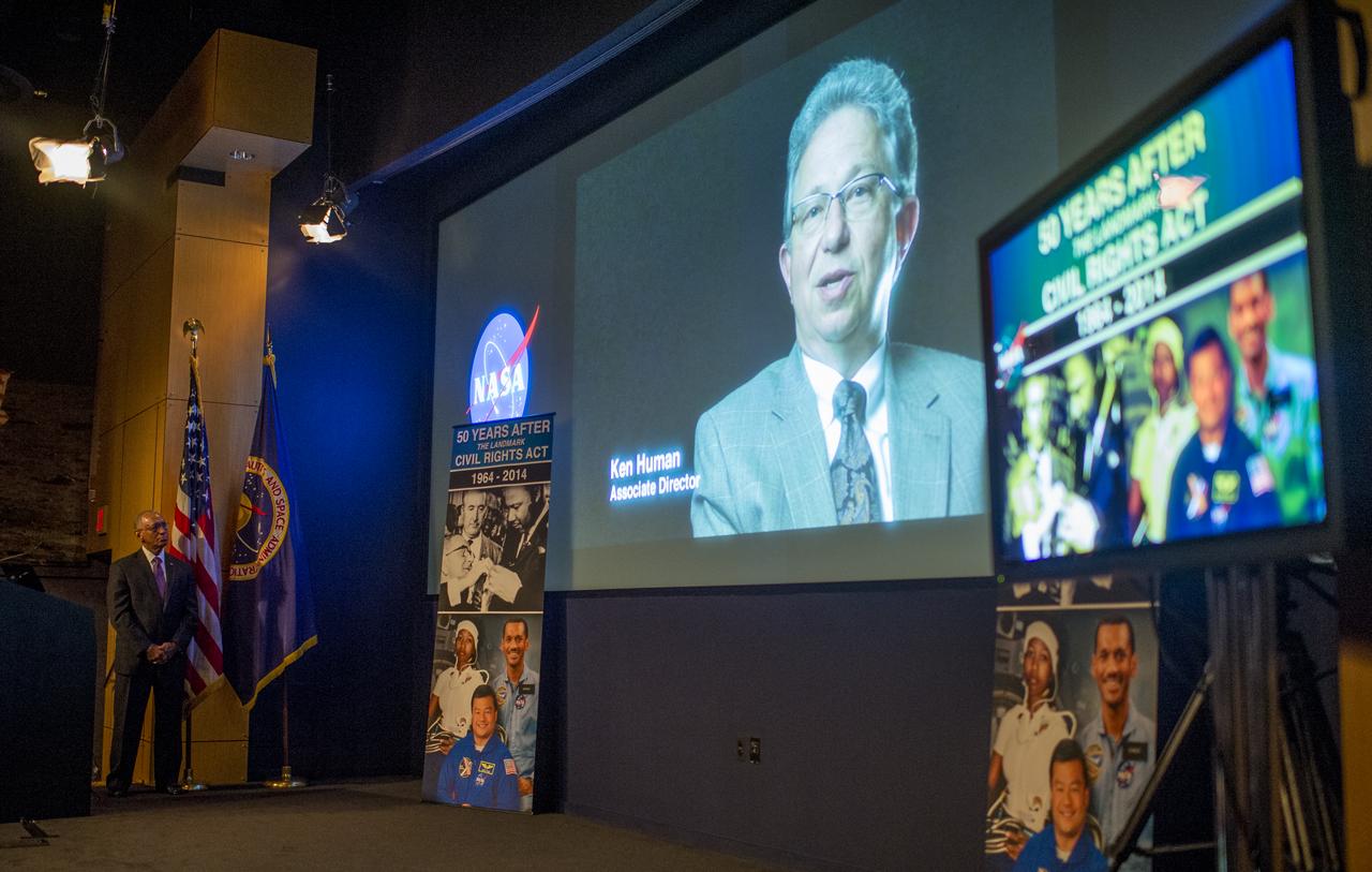 NASA Administrator Charles Bolden watches as a video entitled "50 Years After" plays at an event celebrating the 50th Anniversary of the Civil Rights Act of 1964 on Monday, June 23, 2014 in the James E. Webb Auditorium at NASA Headquarters in Washington, DC.  The event highlighted the influence of the Civil Rights Act on NASA.  Photo Credit: (NASA/Joel Kowsky)