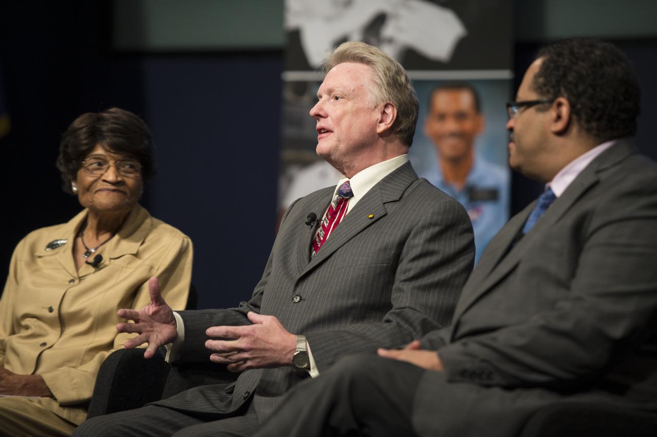 Dr. Roger Launius, Associate Director of Collections and Curatorial Affairs at the Smithsonian National Air and Space Museum, center; speaks as part of a panel discussion at an event celebrating the 50th Anniversary of the Civil Rights Act of 1964 on Monday, June 23, 2014 in the James E. Webb Auditorium at NASA Headquarters in Washington, DC. The event highlighted the influence of the Civil Rights Act on NASA. Photo Credit: (NASA/Joel Kowsky)
