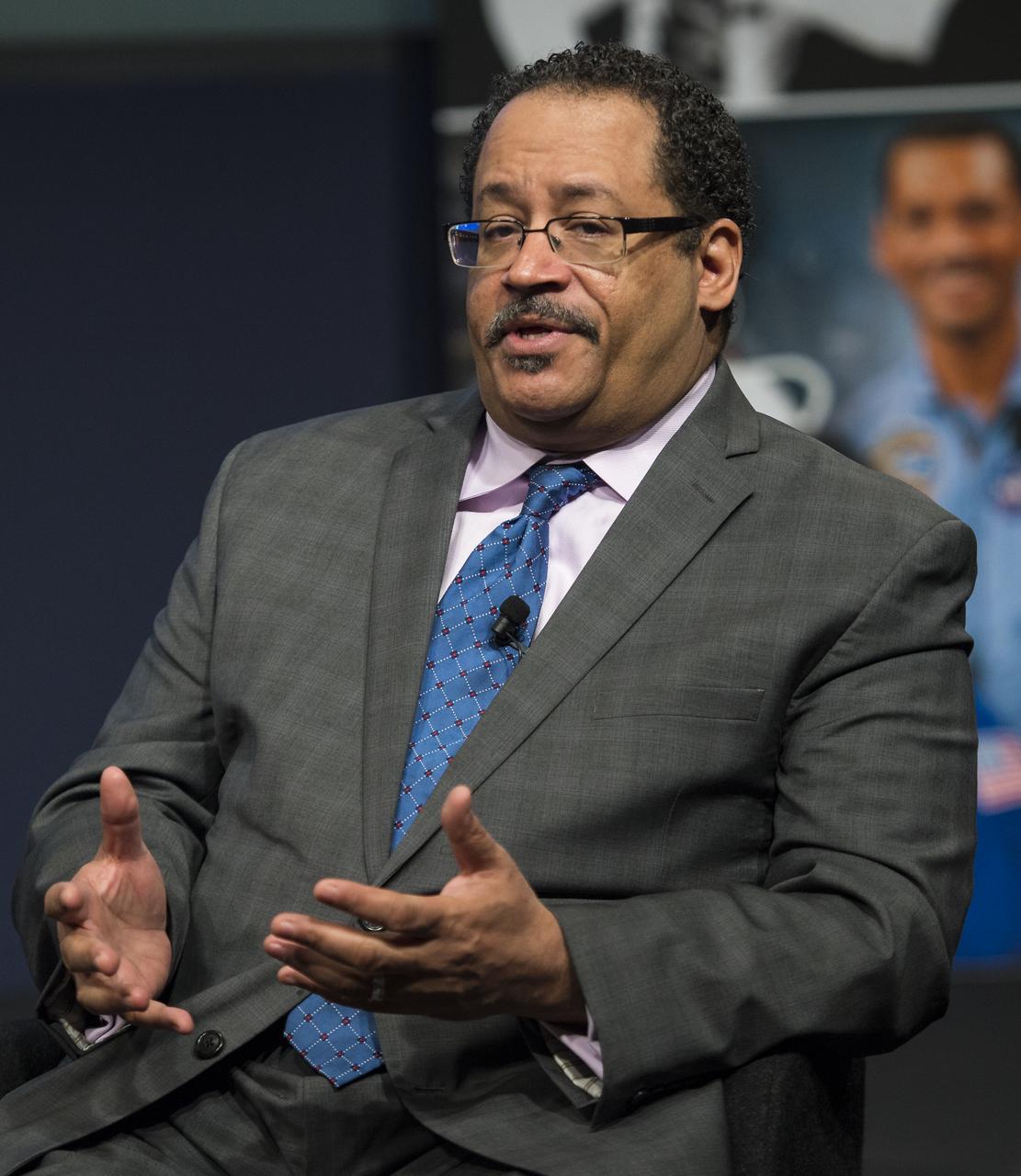 Dr. Michael Eric Dyson, a professor of sociology at Georgetown University, speaks as part of a panel discussion at an event celebrating the 50th Anniversary of the Civil Rights Act of 1964 on Monday, June 23, 2014 in the James E. Webb Auditorium at NASA Headquarters in Washington, DC. The event highlighted the influence of the Civil Rights Act on NASA. Photo Credit: (NASA/Joel Kowsky)