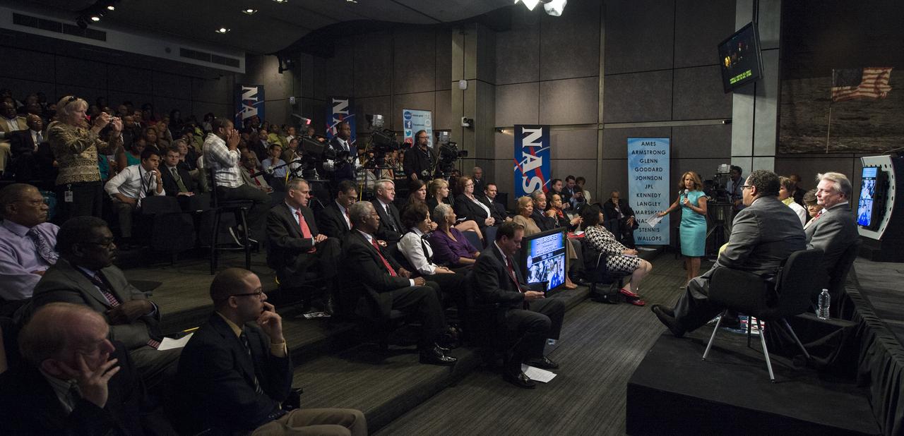 Members of the audience listen as U.S. Representative Eddie Bernice Johnson, of Texas; Dr. Harriet Jenkins, Former Assistant Administrator for Equal Opportunity Programs at NASA;  Dr. Roger Launius, Associate Director of Collections and Curatorial Affairs at the Smithsonian National Air and Space Museum; and Dr. Michael Eric Dyson, a professor of sociology at Georgetown University; speak on a panel moderated by Suzanne Malveaux, of CNN, at an event celebrating the 50th Anniversary of the Civil Rights Act of 1964 on Monday, June 23, 2014 in the James E. Webb Auditorium at NASA Headquarters in Washington, DC. The event highlighted the influence of the Civil Rights Act on NASA. Photo Credit: (NASA/Joel Kowsky)